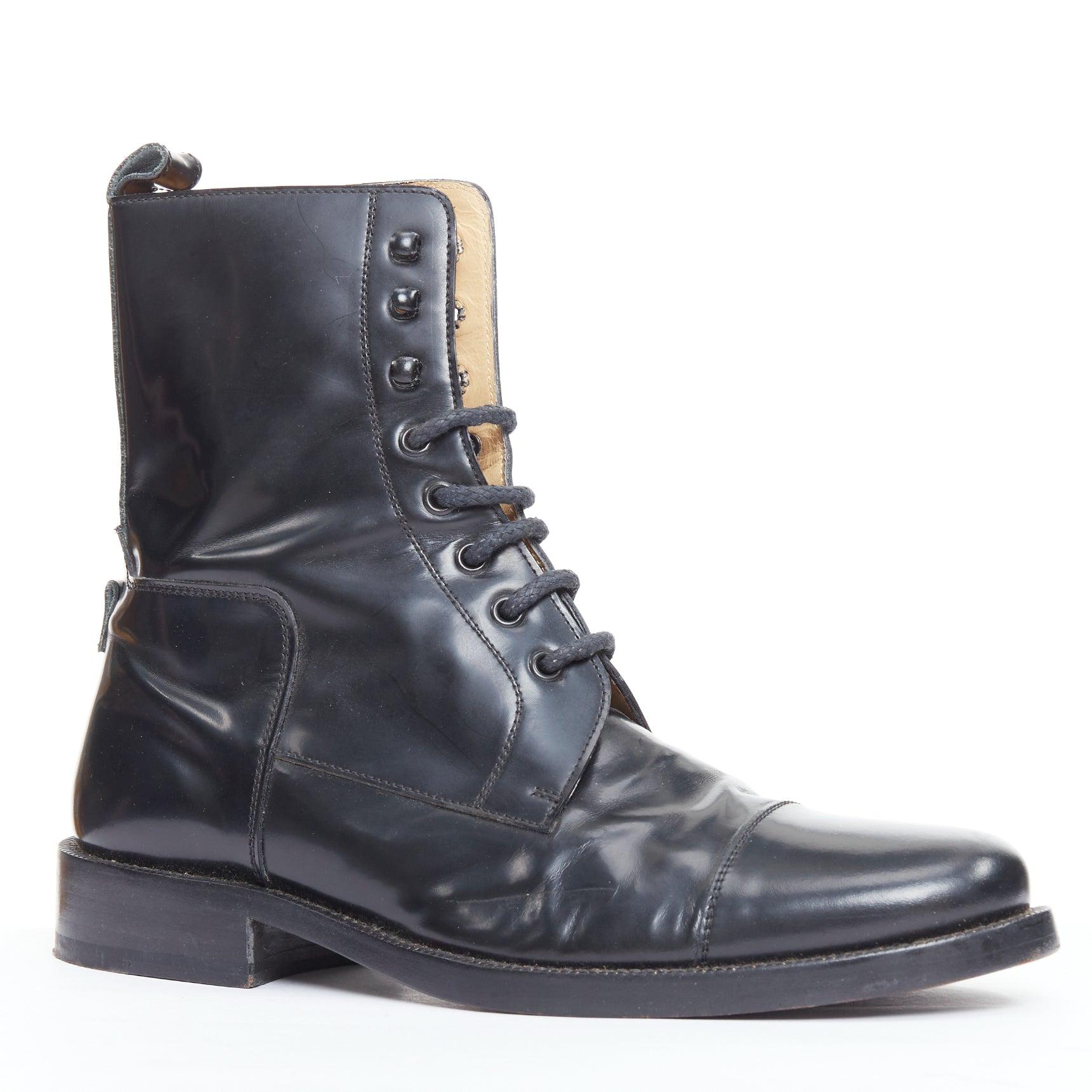 BALENCIAGA black polished leather lace up topstitch combat boots EU41
Reference: PRWU/A00178
Brand: Balenciaga
Material: Leather
Color: Black
Pattern: Solid
Closure: Lace Up
Lining: Nude Leather
Made in: Italy

CONDITION:
Condition: Fair, this item