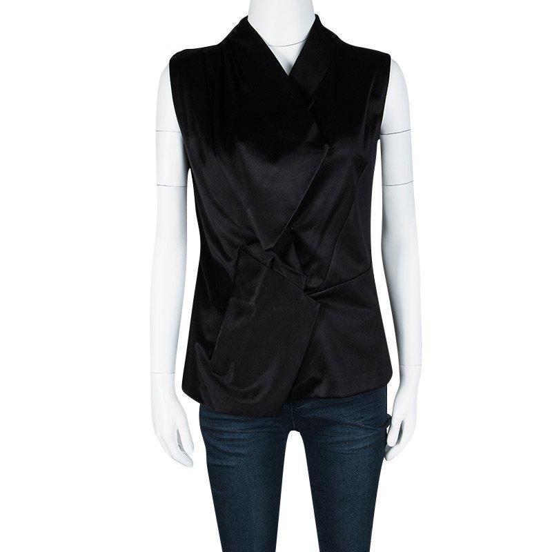 Let your closet experience a fabulous addition with this vest from Balenciaga. The satin vest has been styled with a black hue and asymmetric detailing on the front.

Includes: The Luxury Closet Packaging

