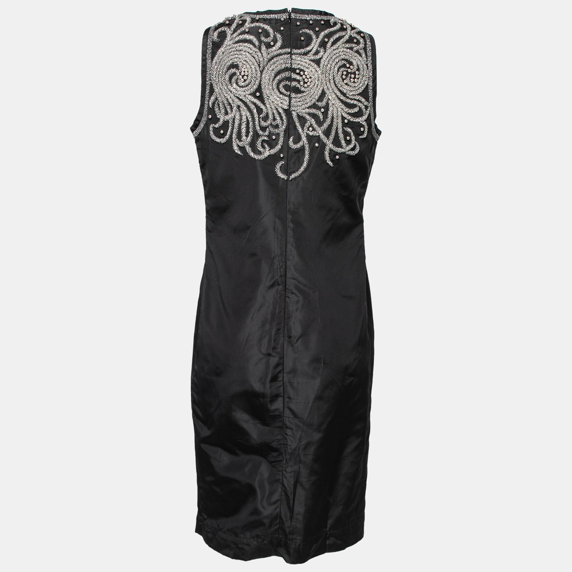 This dress from Balenciaga is so pretty, you'll love wearing it. The fabulous creation is made of silk and features an elegant design with bead embellishments on the top front and back along with a sleeveless style. Pair it with strappy sandals for