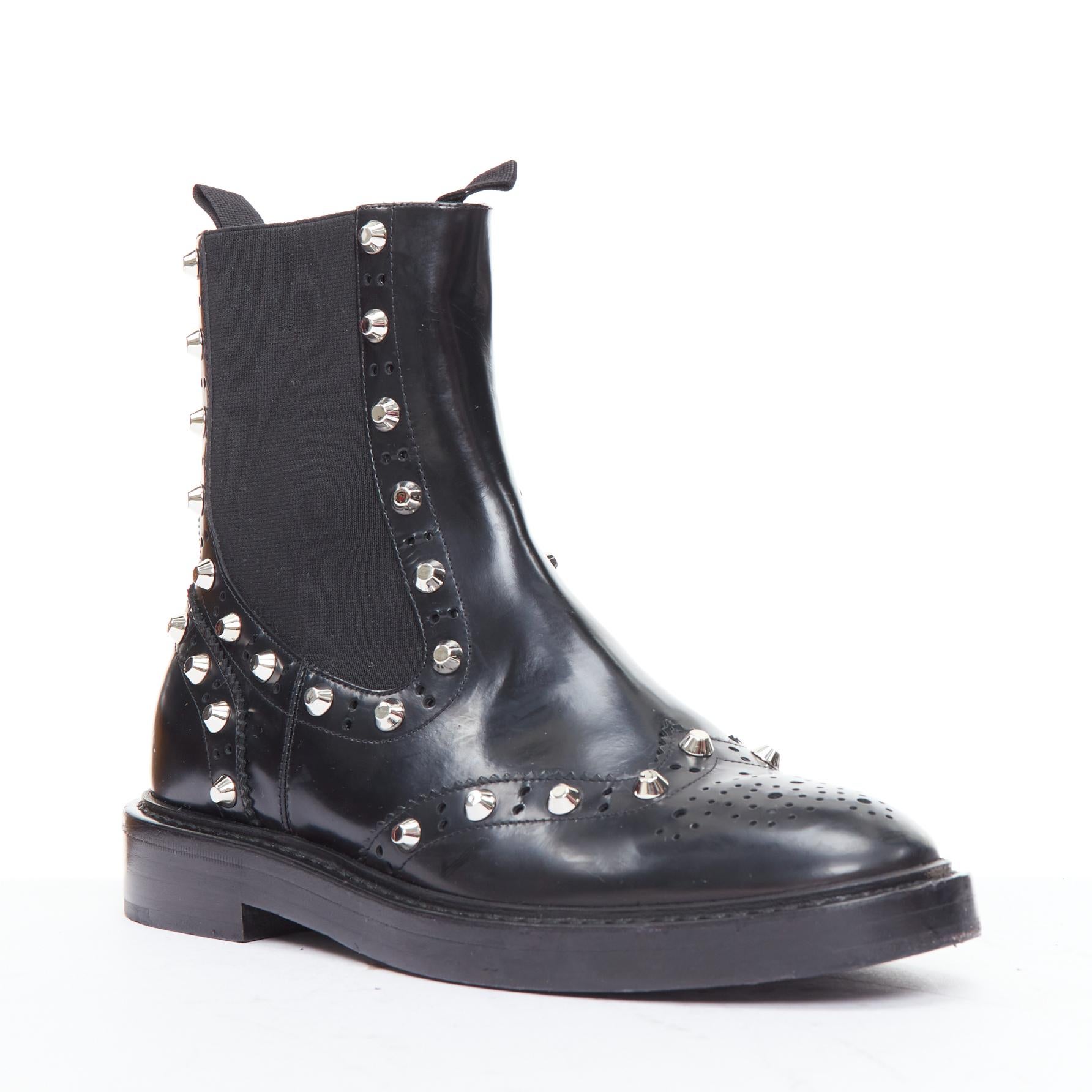 BALENCIAGA black silver studded brogue chelsea ankle boots EU38
Reference: ECLO/A00084
Brand: Balenciaga
Material: Leather
Color: Black, Silver
Pattern: Solid
Closure: Slip On
Lining: Black Leather
Extra Details: Elasticated openings.
Made in:
