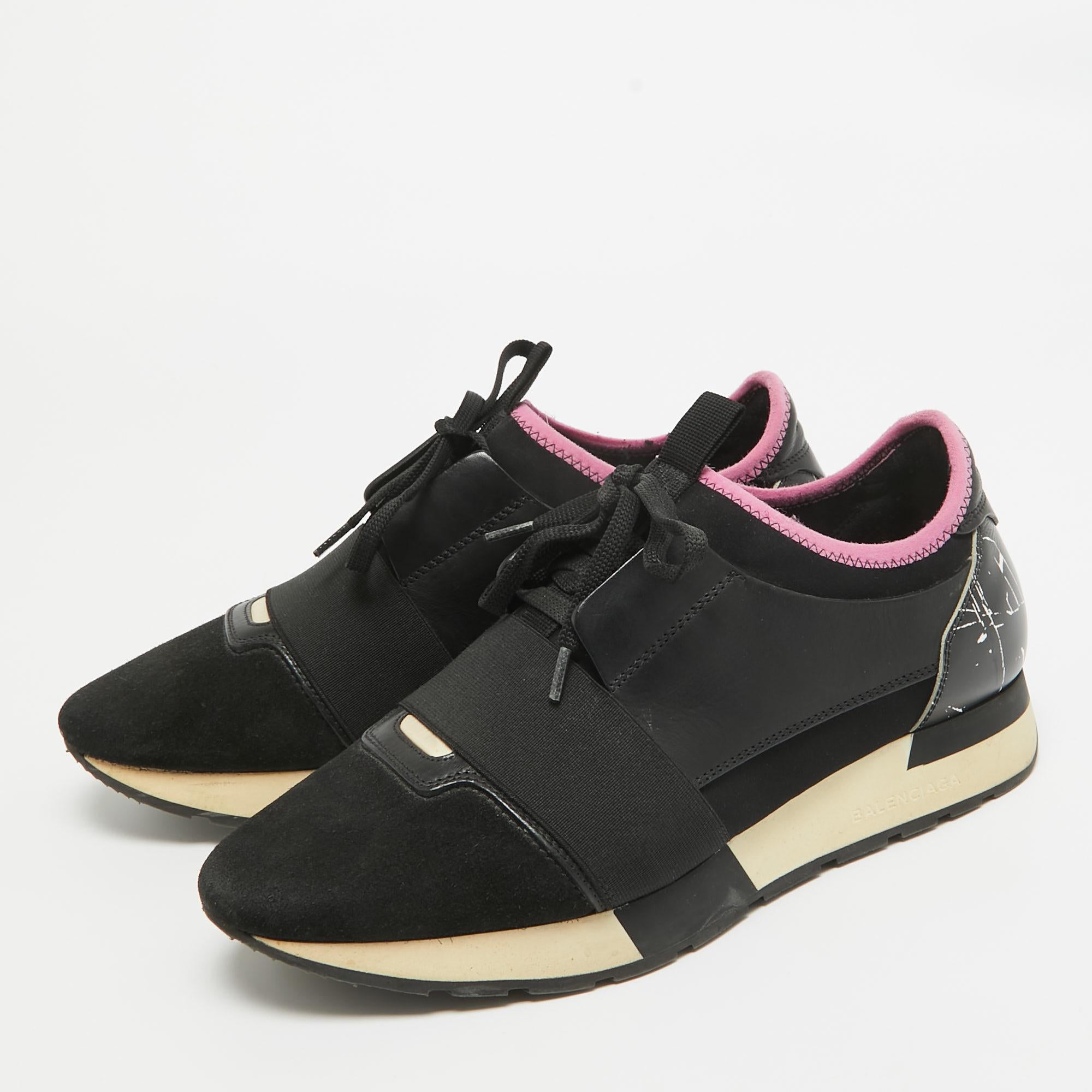The Balenciaga Race Runner sneakers have been crafted from quality materials and feature a chic silhouette. They flaunt covered toes, strap detailing on the vamps, and tie-up fastenings. They are complete with a leather-lined insole and a tough base