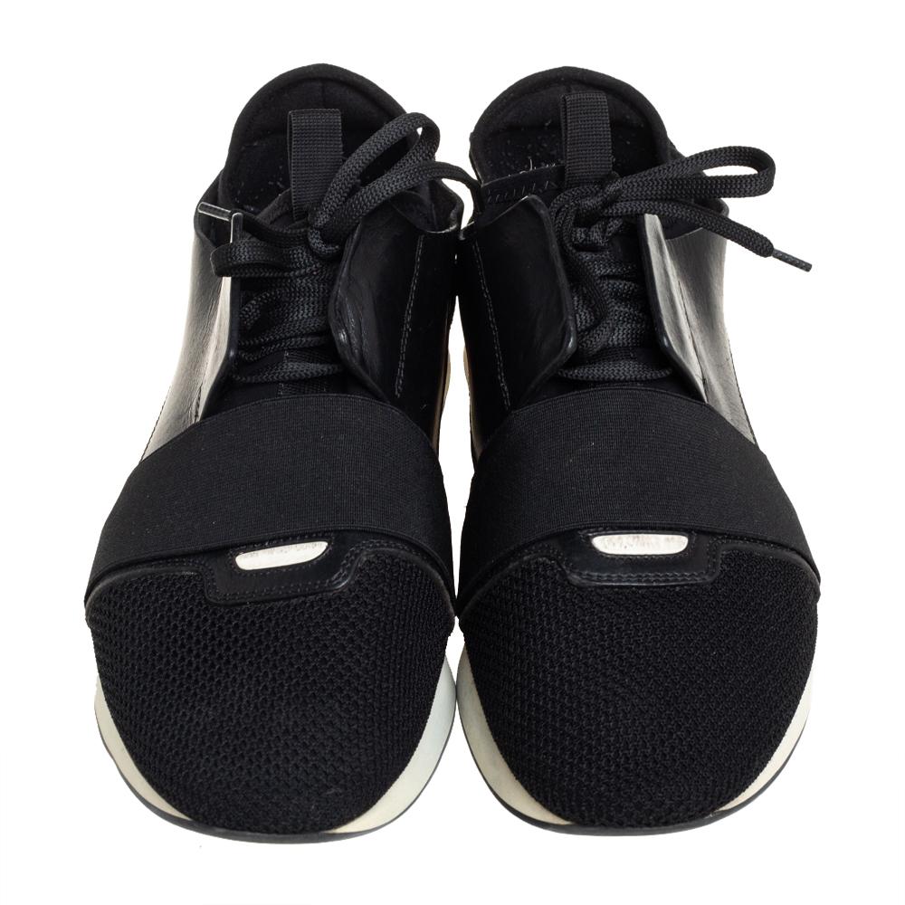 Let your latest shoe addition be this pair of Race Runner sneakers from Balenciaga. These black sneakers have been crafted from mesh, suede, fabric, and leather and feature a chic silhouette. They flaunt covered toes, strap detailing on the vamps,