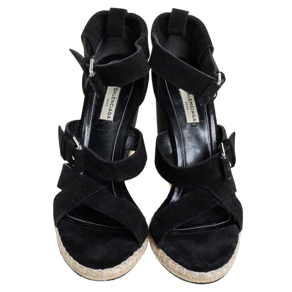 These lovely Balenciaga wedge sandals will bring you the right amount of style and comfort. They feature suede straps in a black shade, a strappy layout, ankle strap fastenings, and 10.5 cm wedge heels for the right lift.

