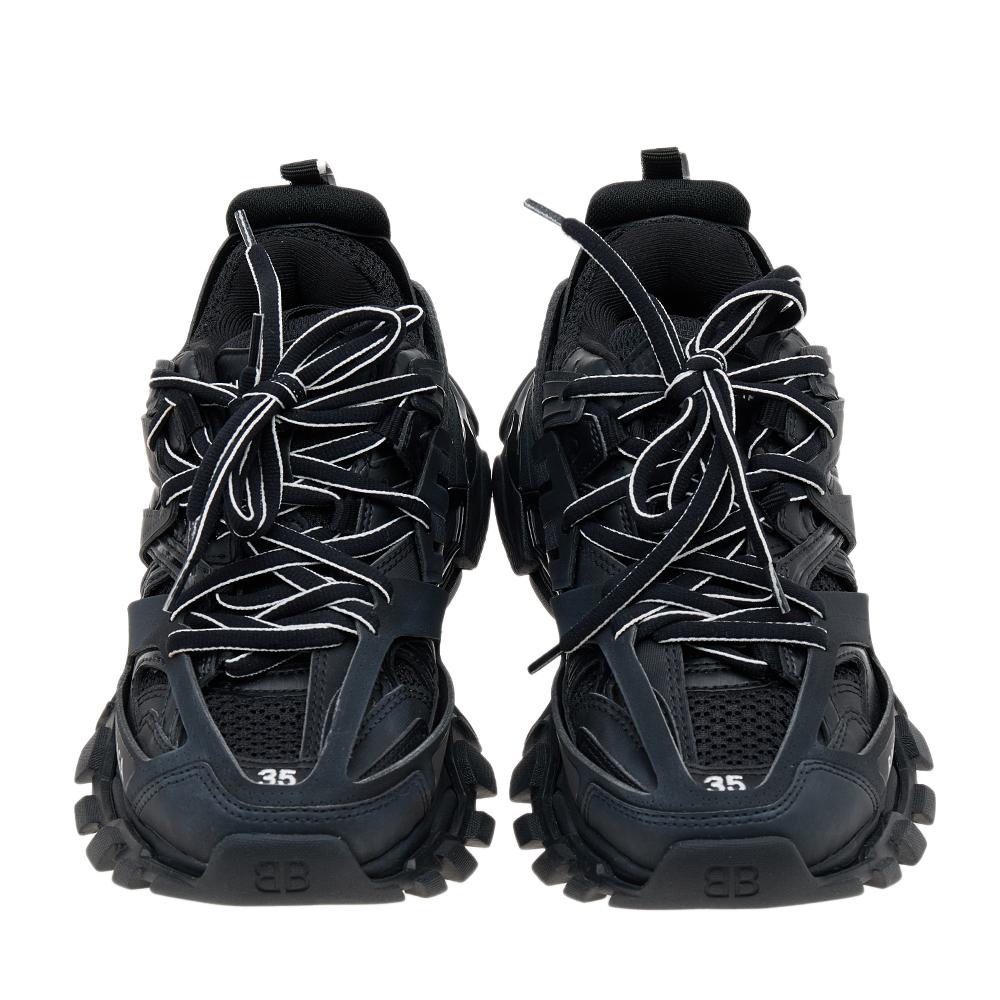 Add a sporty element to your ensemble by wearing these stunning sneakers from the House of Balenciaga. They are created using black synthetic leather and mesh into a classic low-top silhouette. They showcase lace-ups and tough rubber soles. These