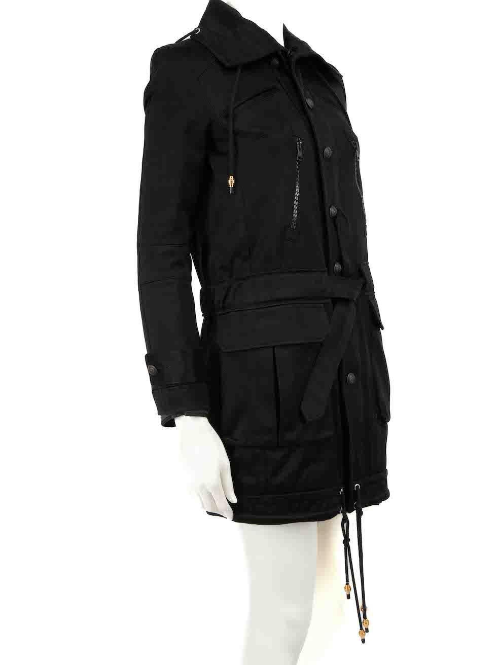 CONDITION is Very good. Minimal wear to coat is evident. Minimal wear to the centre-front button fastening with discolouration to the placket on this used Balenciaga designer resale item.
 
Details
Black
Cotton
Trench coat
Zip and button