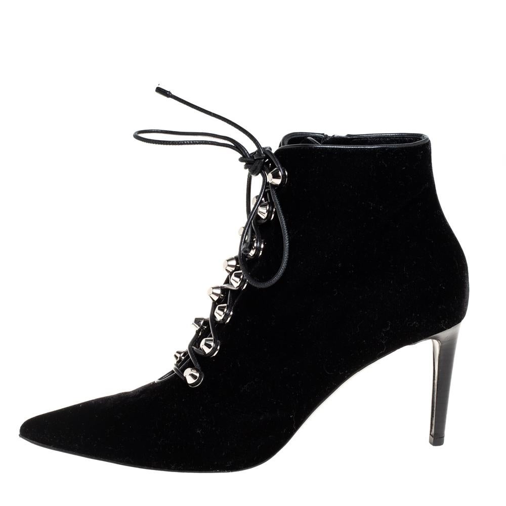 It's time to rock all your outings with these stylish ankle boots from Balenciaga. Modern in design and craftsmanship, these boots are crafted from velvet and designed with pointed toes, studded lace-up vamps, and slim heels. Pair these beauties