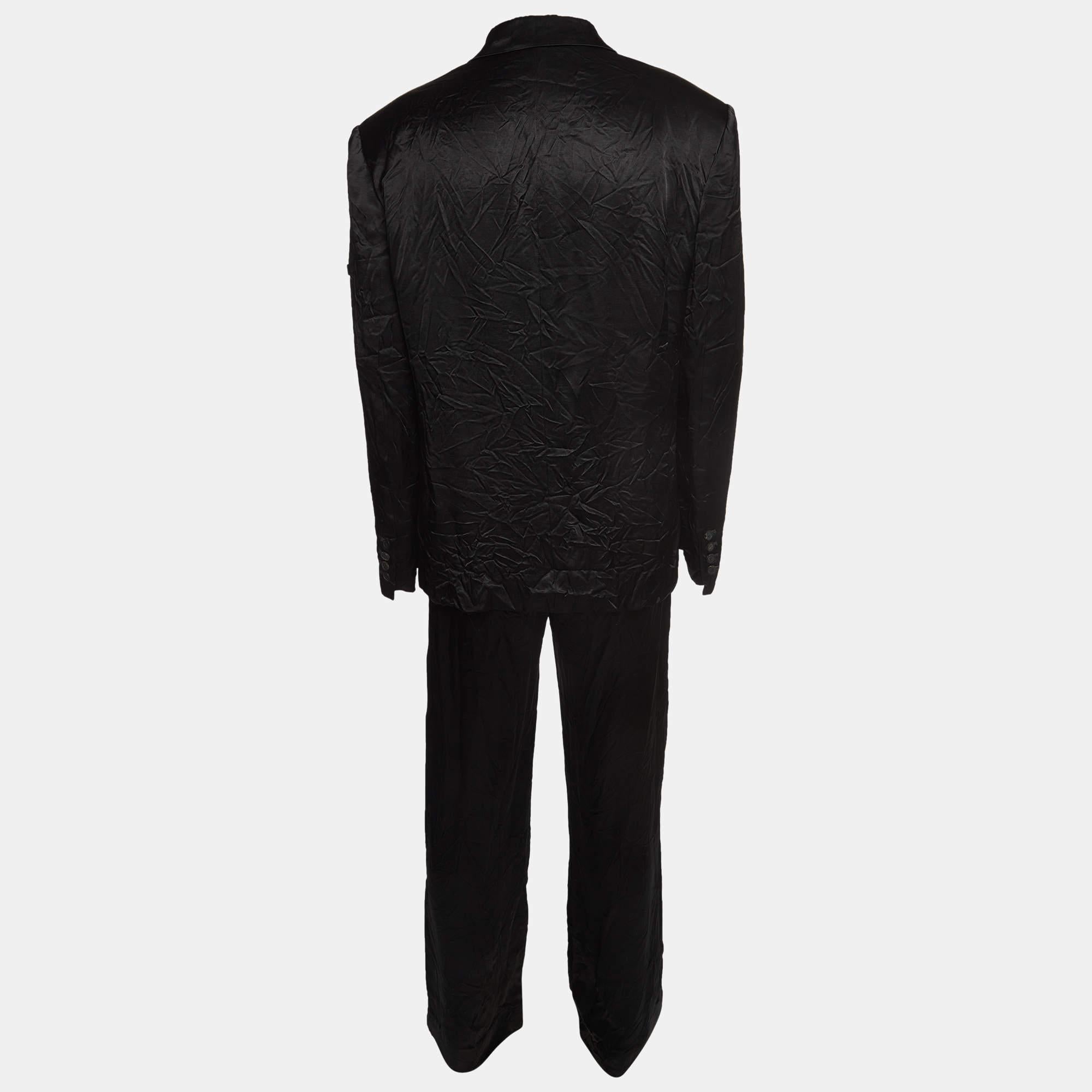 The Balenciaga suit exudes sophistication with its meticulously tailored design. Crafted from premium washed crepe, the sleek black ensemble features subtle logo appliques, elevating the classic suit into a modern, fashion-forward statement piece