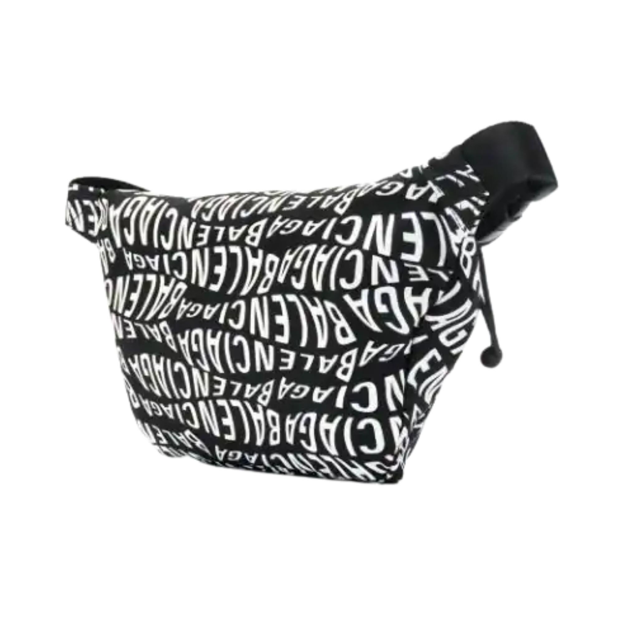 Canvas pouch in black featuring logo pattern printed in white throughout. Adjustable webbing belt-style strap with press-release fastening. Logo embroidered in white and zippered compartment at face. Zip closure at main compartment. Logo patch at