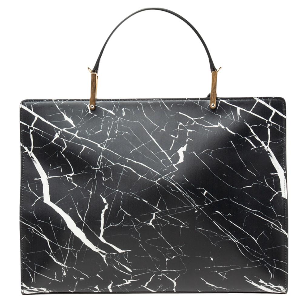 This Balenciaga design exudes luxury and beauty! It comes crafted from leather and added with a front flap and a top handle. The marble print gives the exterior a classy look and the spacious interior that is lined with leather will help carry your