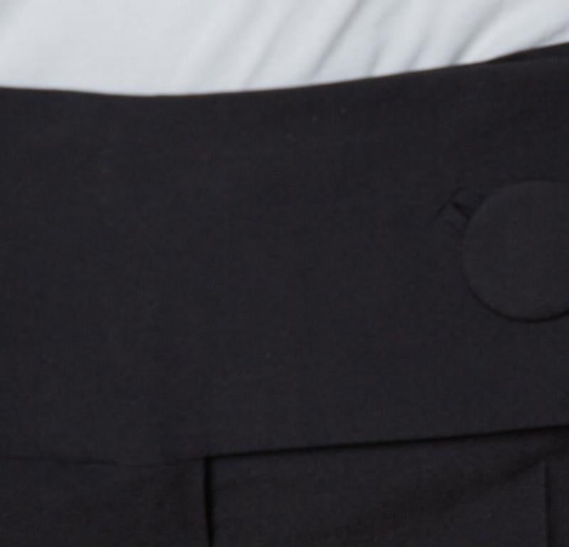 Wear these well-tailored pants with a bodysuit and oversized blazer - a combination that won't let you down at the office or an event. From the house of Balenciaga, this black pair is cut to a smart fit with a broad flap button closure at the