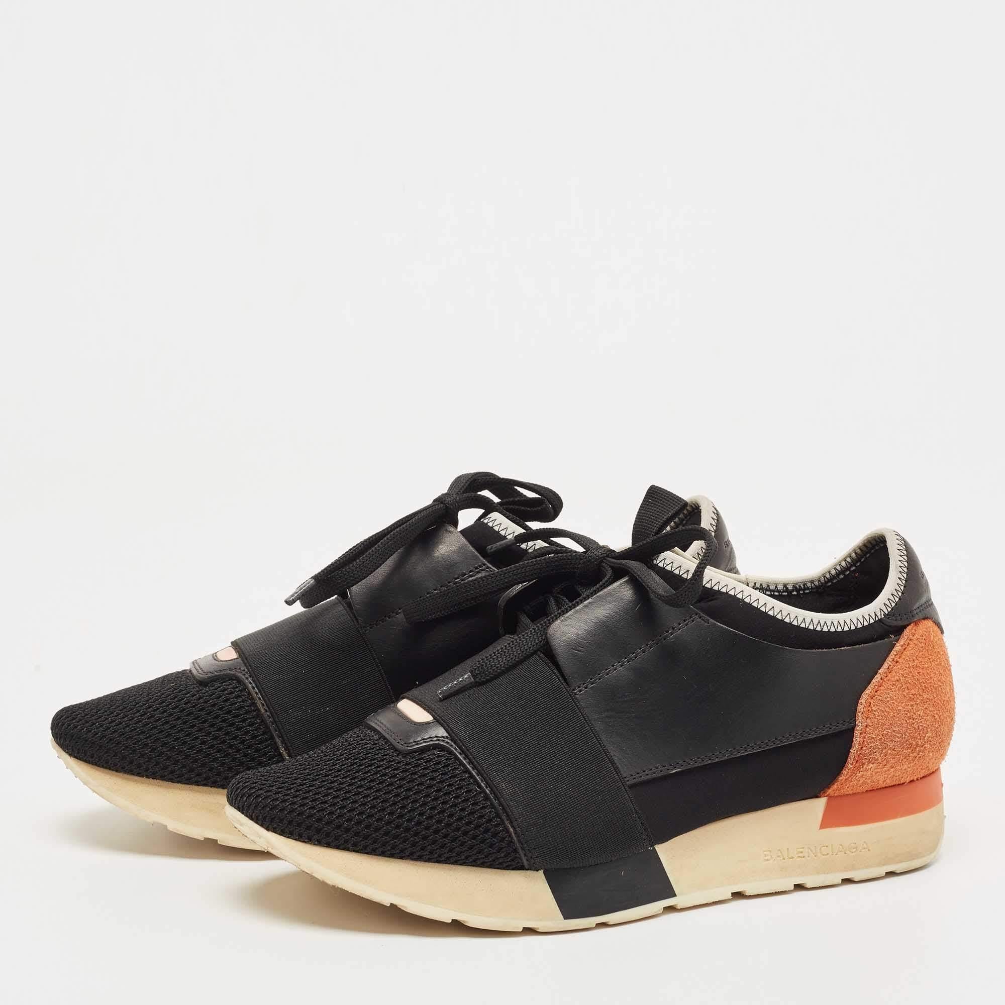 Let your latest shoe addition be this pair of Race Runners sneakers from Balenciaga. These black sneakers have been crafted from leather, suede, and mesh and feature a chic silhouette. They flaunt covered toes, fabric strap detailing on the vamps,