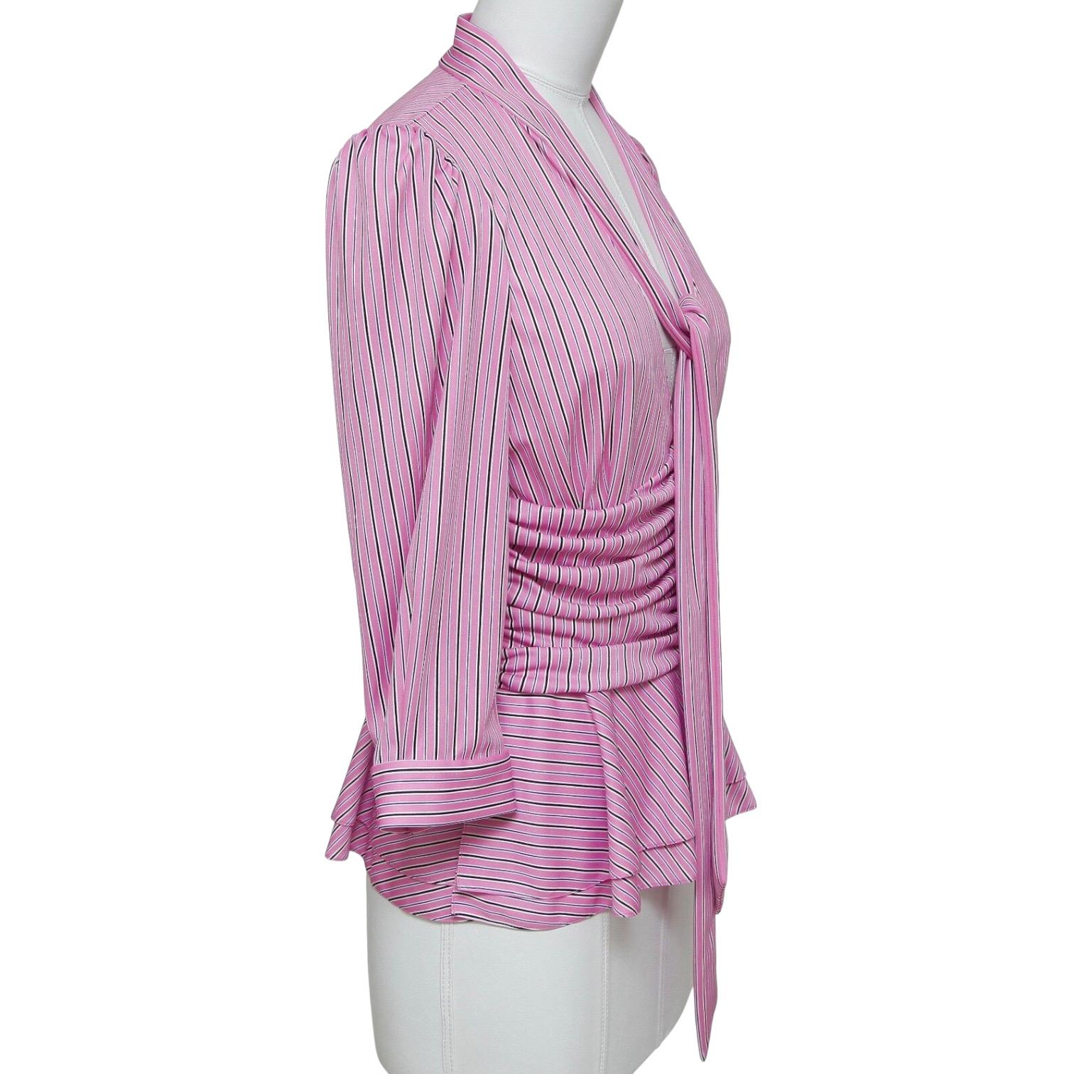 GUARANTEED AUTHENTIC BALENCIAGA STRIPED 3/4 SLEEVE BLOUSE

Retailed excluding sales taxes $1,195

Design:
- Striped blouse in beautiful rose, white and black colors.
- Attached neck tie.
- 3/4 sleeves with self covered buttons.
- Pleating across