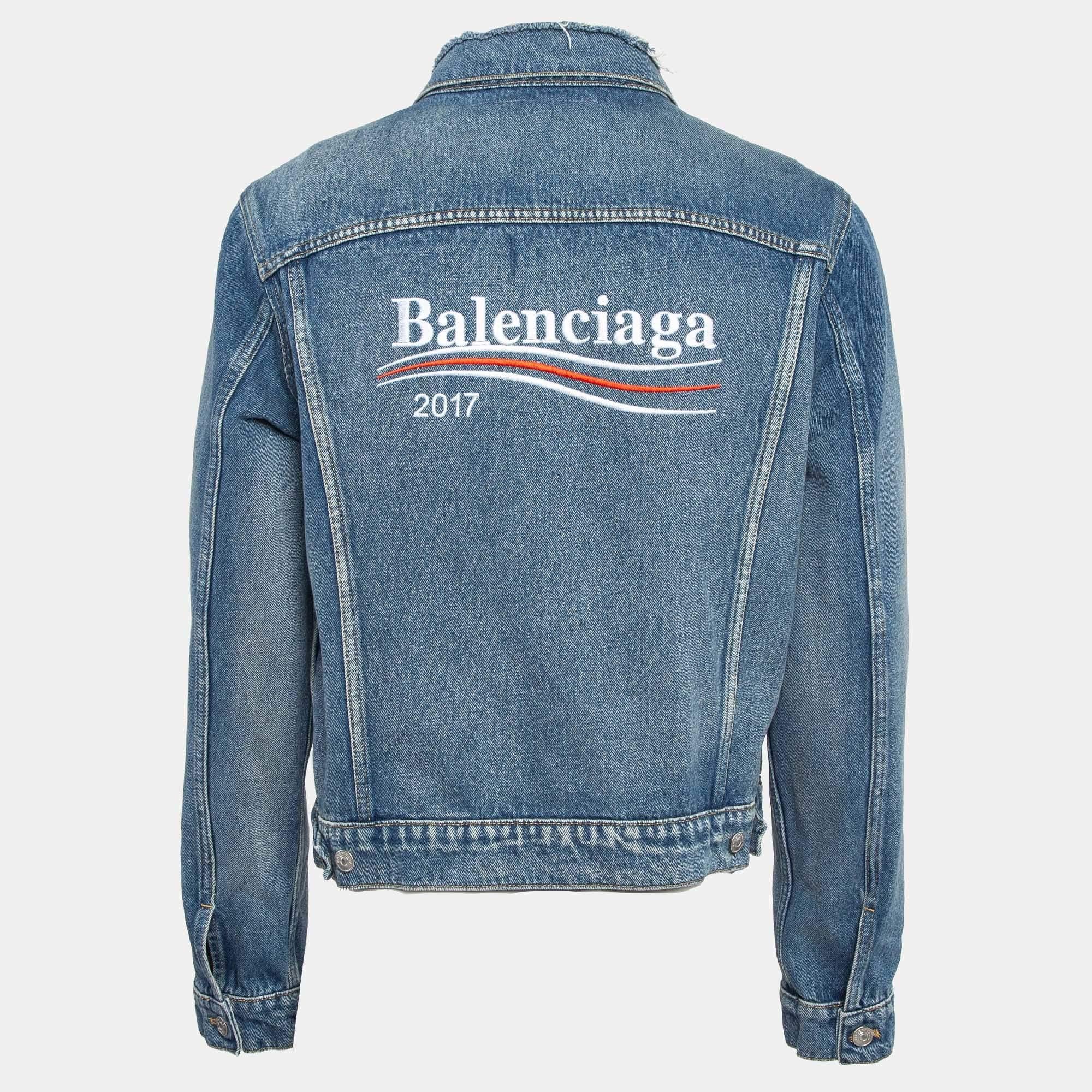 Nail an ultra cool look with this Balenciaga mens denim jacket. Tailored beautifully using blue denim the jacket is added with four pockets front button closure and the brand logo on the back.