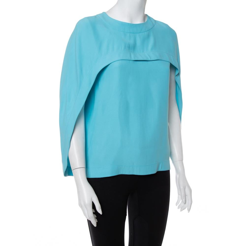 Balenciaga brings to you this amazing top that is perfect to add to your luxe wardrobe. The blue crepe creation has been designed with cape sleeves and a round neckline. It is sure to lend you a fantastic fit and will look good with straight-leg