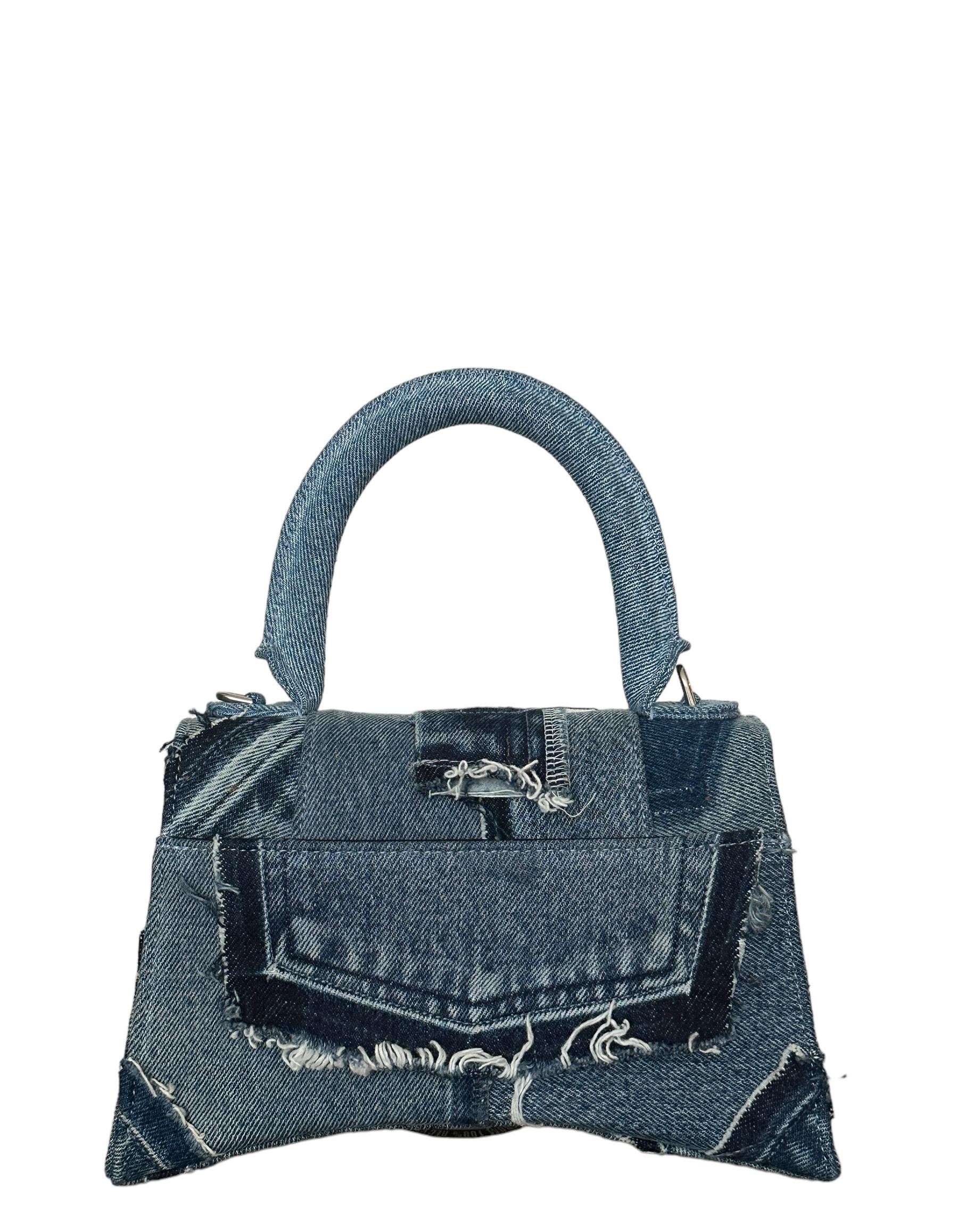 Balenciaga Blue Denim Patchwork Small Hourglass Top Handle Bag

Made In: Italy
Color: Blue
Hardware: Aged silvertone
Materials: Denim
Lining: Black textile
Closure/Opening: Flap top with magnetic closure
Exterior Pockets: Back slit pocket
Interior