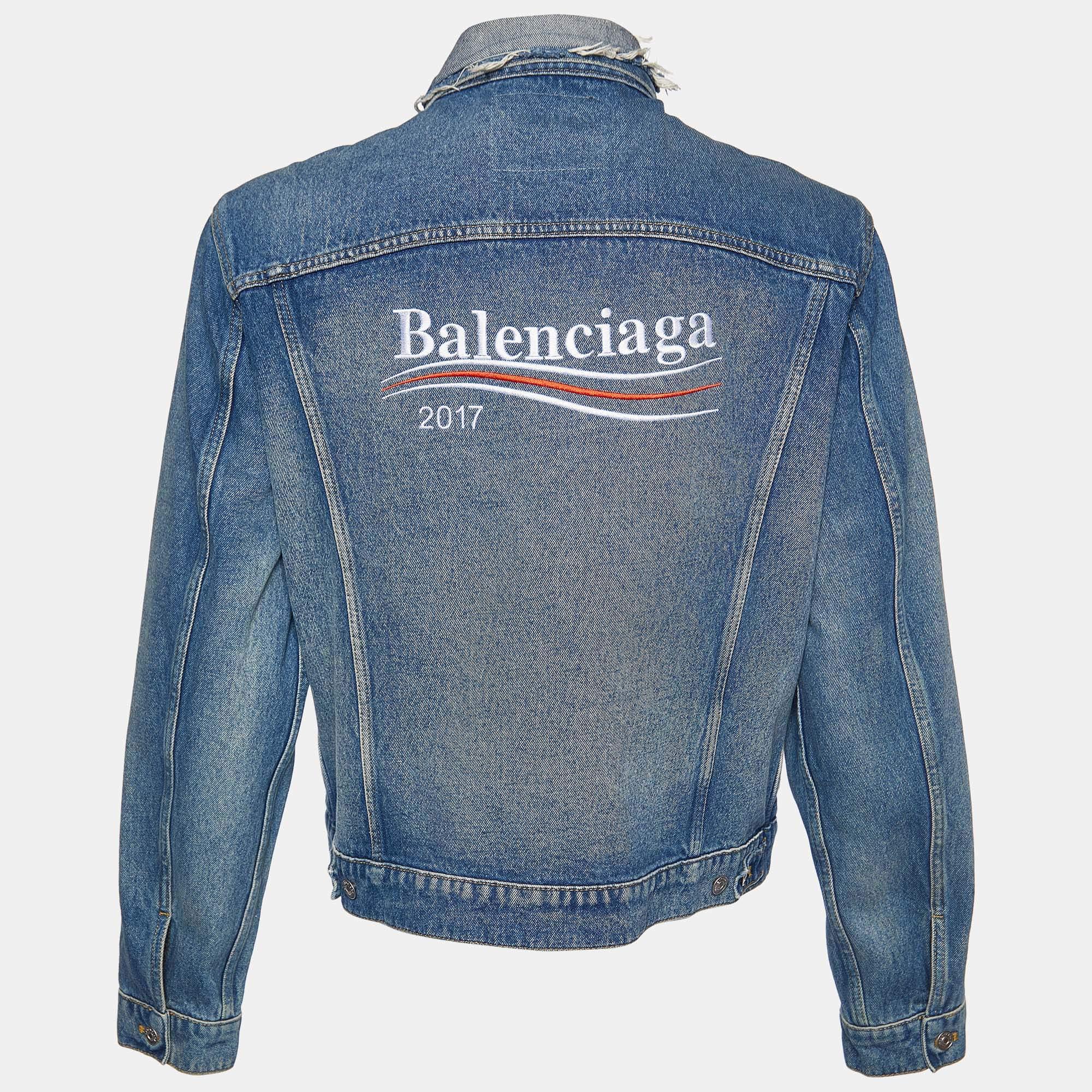 The Balenciaga jacket effortlessly blends urban edge with high-fashion finesse. Crafted from premium distressed denim, its relaxed silhouette exudes contemporary cool. The iconic Balenciaga logo is meticulously embroidered, adding a touch of luxury