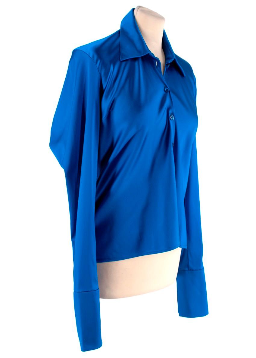 Balenciaga Blue Draped Satin Shirt

- Cut from incredibly lustrous satin in a royal-blue shade 
- Deconstructed silhouette
- Elongated shoulders create a draped effect at the back

Materials:
81% Acetate
16% Viscose
3% Elastane

Made in Italy
Dry