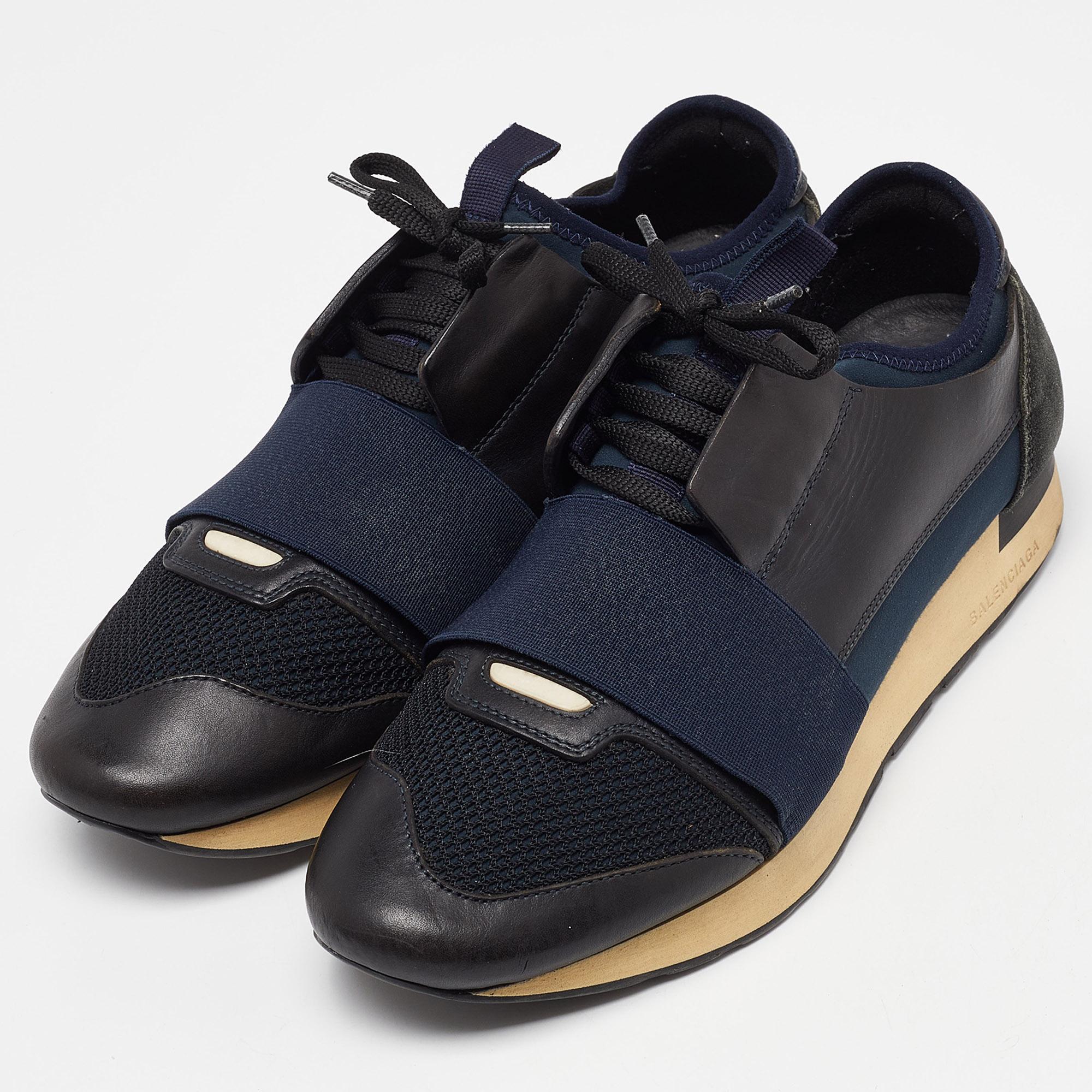 The Balenciaga Race Runner sneakers have been crafted from quality materials and feature a chic silhouette. They flaunt covered toes, strap detailing on the vamps, and tie-up fastenings. They are complete with a leather-lined insole and a tough base