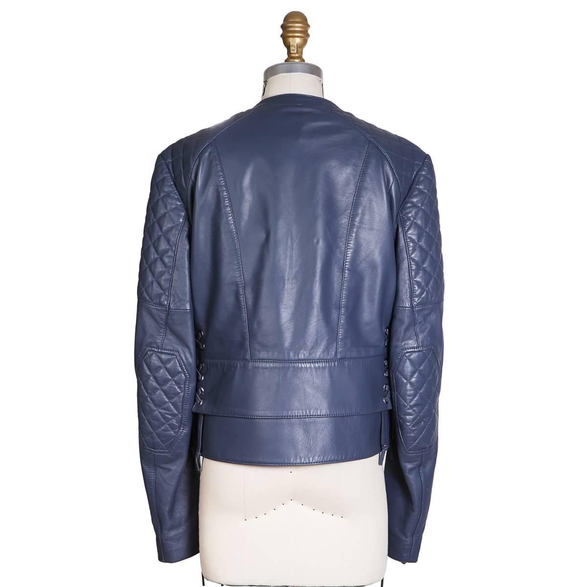 Motorcycle style jacket from Balenciaga
Blue leather with quilting around shoulders
Lace up detail on sides
Condition: Excellent

Size/Measurements:
Size 40
17