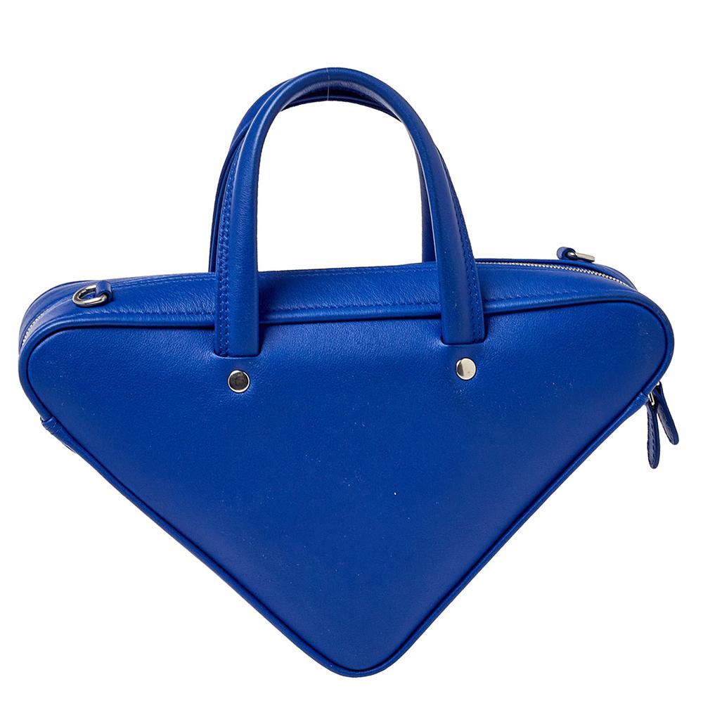 Designed to last, this awesome bag from Balenciaga can uplift the look of your outfit. Crafted from leather in a distinctive triangular shape, this duffle bag exudes style, simplicity, and elegance in equal measures.

Includes: Original Dustbag,