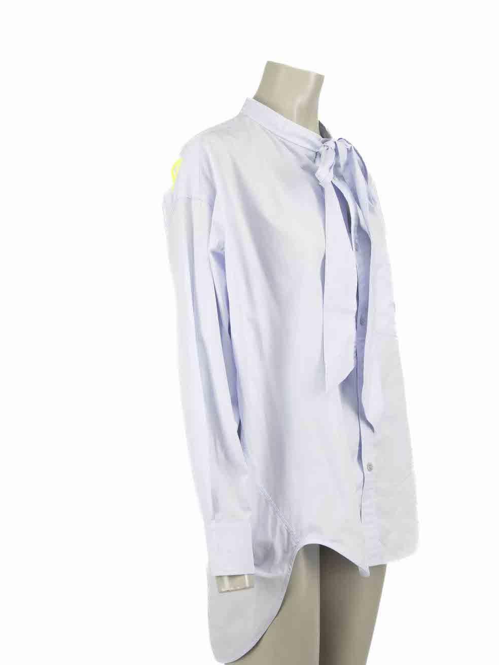 CONDITION is Very good. Minimal wear to shirt is evident. Minimal wear to the left sleeve with small mark on this used Balenciaga designer resale item.

Details
Blue
Cotton
Shirt
Button up fastening
Buttoned cuffs
Oversized fit
Neck tie detail
Back