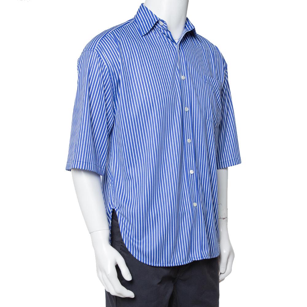 Balenciaga brings you this stylish and comfortable shirt for your casual outings. Made from cotton, the creation features a striped pattern. The Balenciaga shirt is finished off with short sleeves, a hi-low hem, and an oversized fit.


