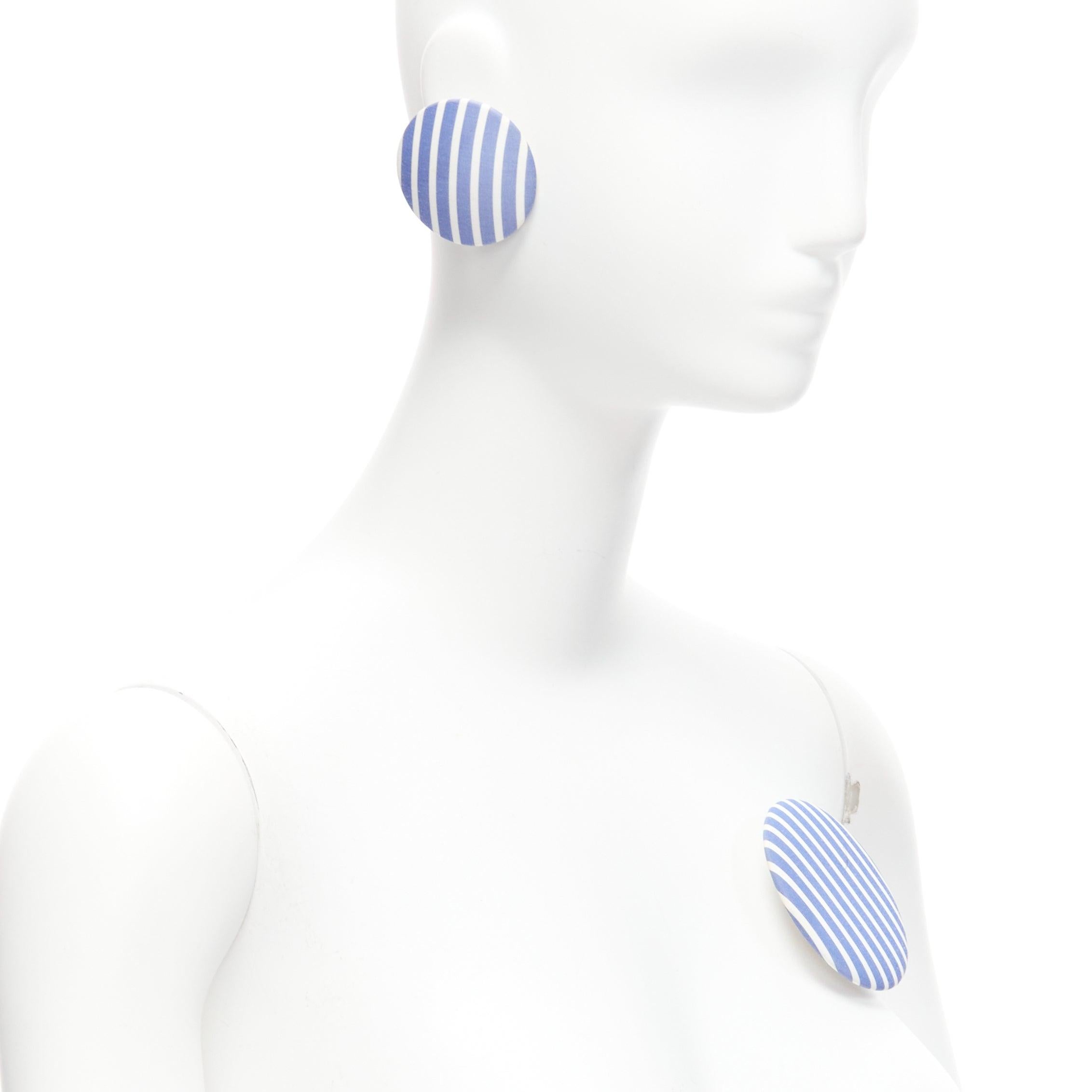 BALENCIAGA blue stripes fabric round badges studs earrings Set 3
Reference: BSHW/A00112
Brand: Balenciaga
Designer: Demna
Material: Fabric
Color: Blue, White
Pattern: Striped
Closure: Pin
Lining: Silver Metal
Extra Details: All 3 can be worn as pin