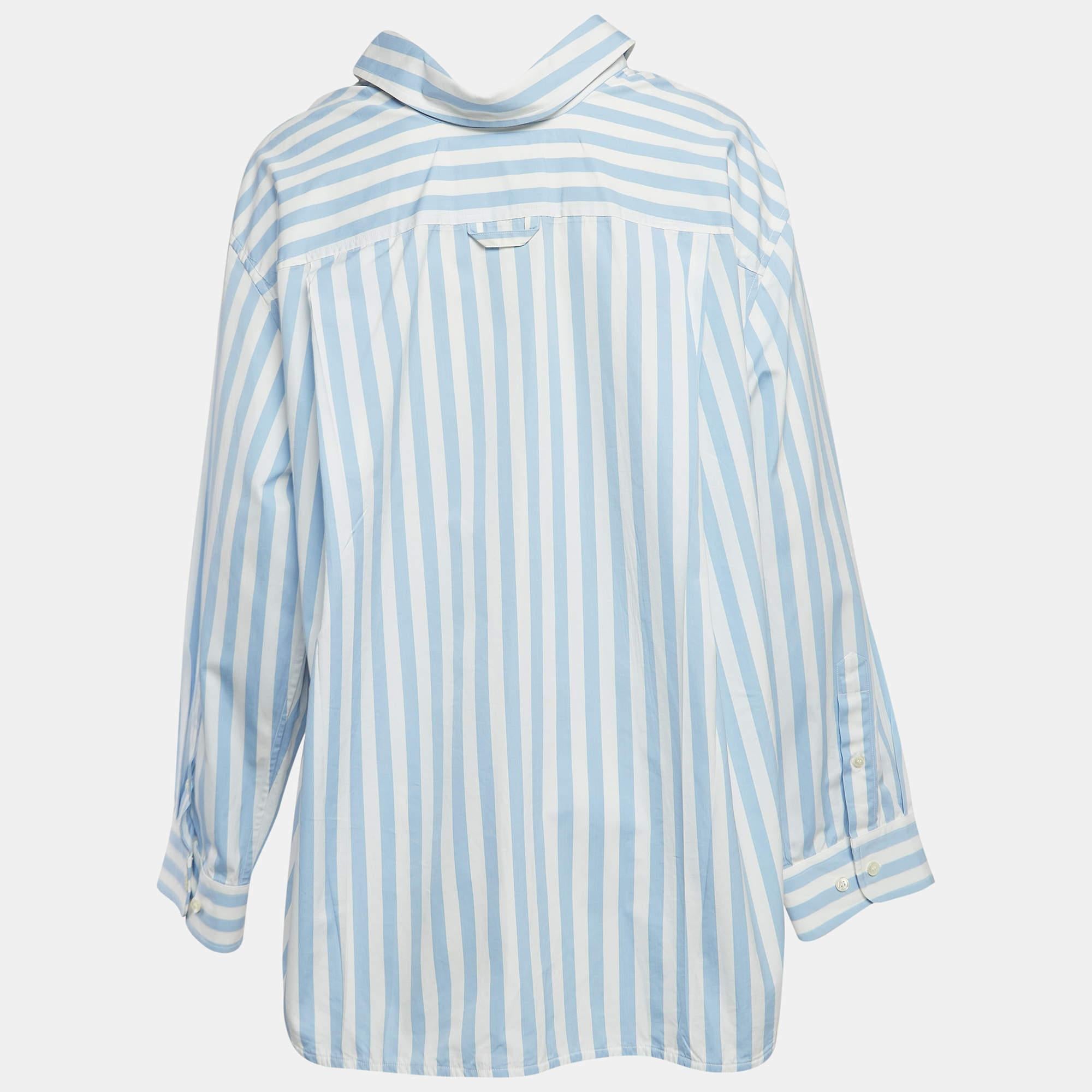 Indulge in effortless sophistication with the Balenciaga shirt. Crafted with premium cotton, its oversized silhouette exudes contemporary charm. The striking blue and white stripes add a touch of timeless elegance, making it a versatile wardrobe