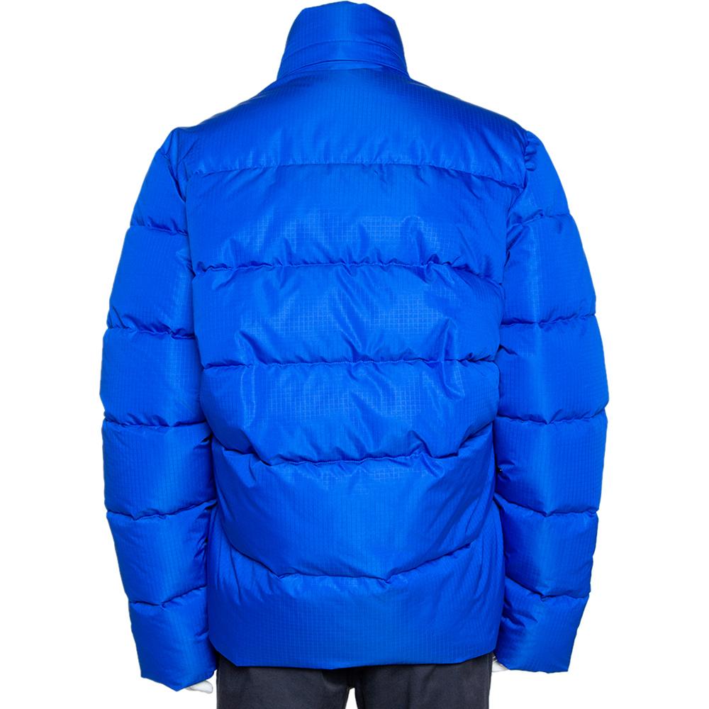 Stay warm in this ultra-stylish puffer jacket by Balenciaga. Designed in a fashionable silhouette, the bright blue quilted jacket is tailored from quality materials, will look great with your winter separates. It features a front zip fastening, two