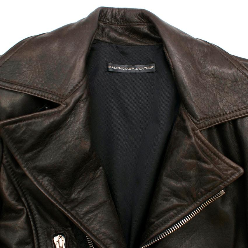 Balenciaga Brown Asymmetrical Leather Jacket 

- Asymmetric Front Zip Fastening 
- Two Side Pockets with Zip Closure 
- Zip Detail On Cuffs 
- Fulling Lined
- Silver-Tone Hardware 
- Textured Leather 

100% Lamb Skin Leather 
Lining 
100% Viscose