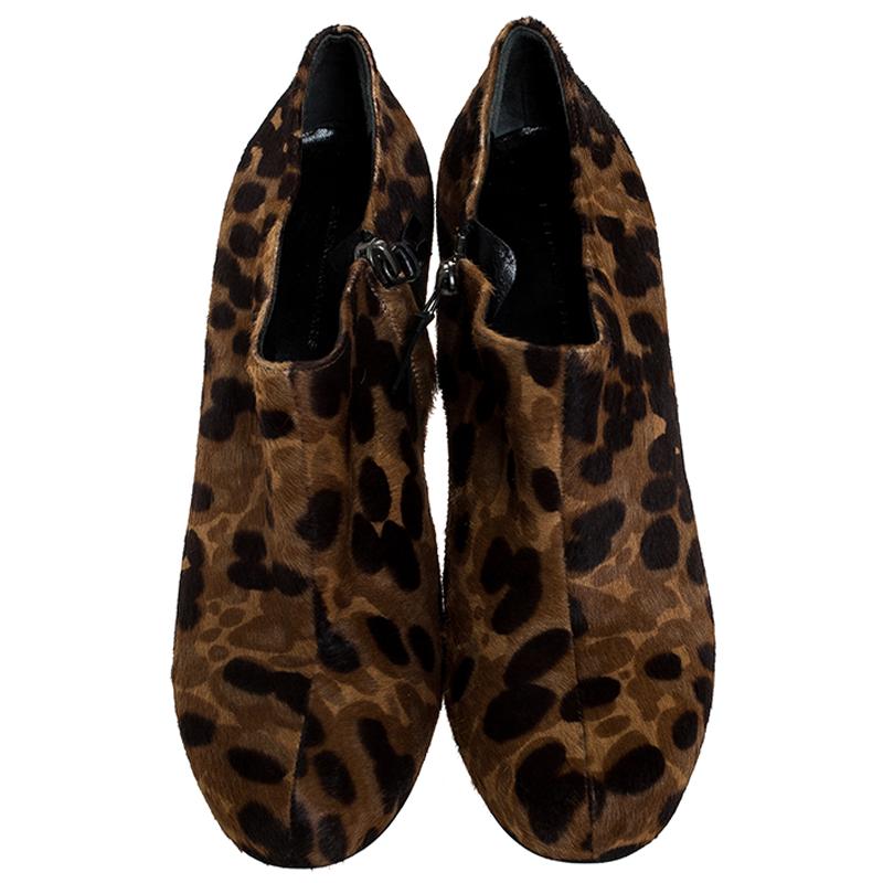 These booties by Balenciaga are stunning. Crafted from leopard printed calfhair, they come in lovely hues of brown and black. They feature round toes, leather lining, insoles and soles. They are finished with 11 cm heels and gunmetal-tone zip