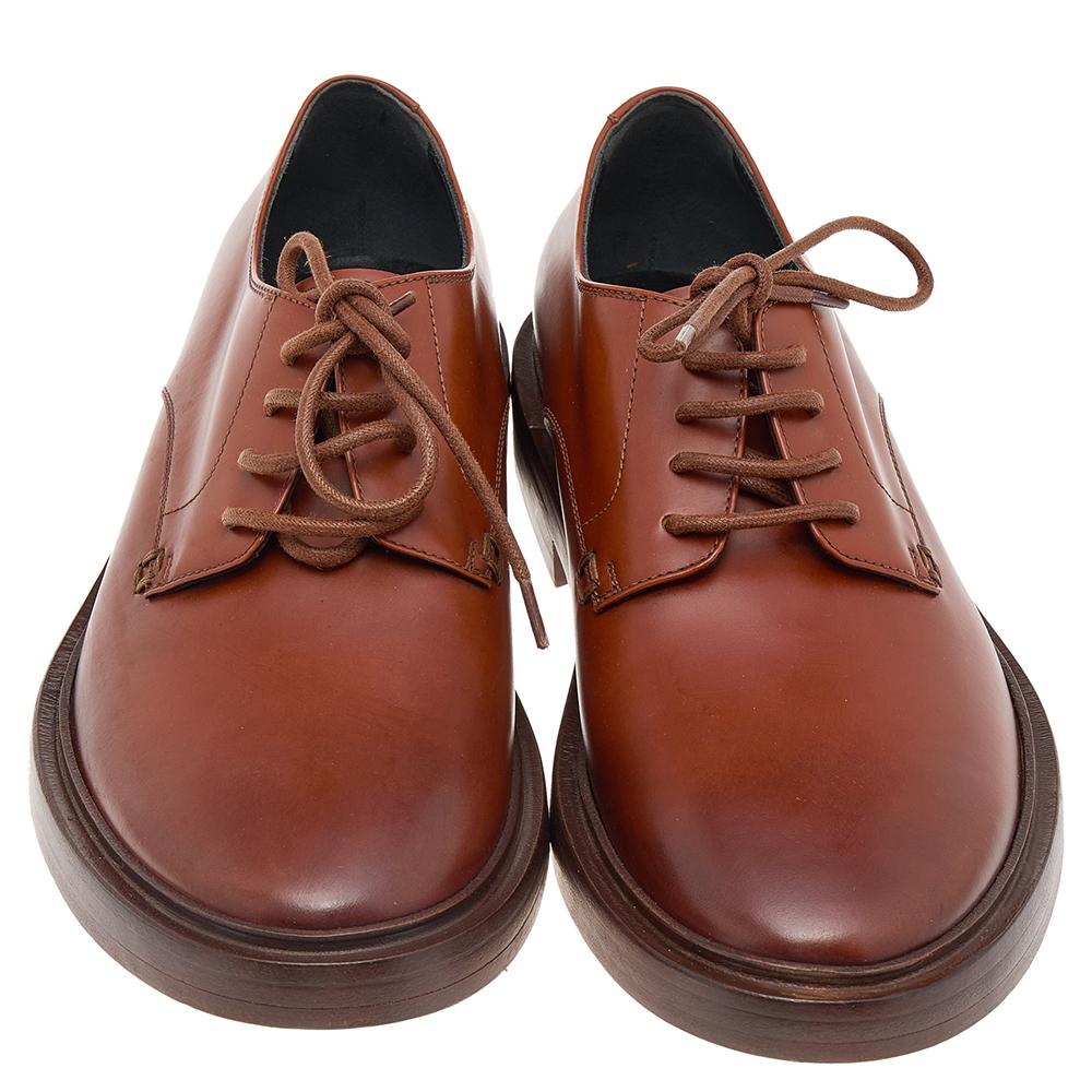 Classic and stylish, these dashing Balenciaga Derby shoes are timeless and easy to style. Designed in leather, this brown pair features a lace-up closure, a low heel, and a durable leather sole.

