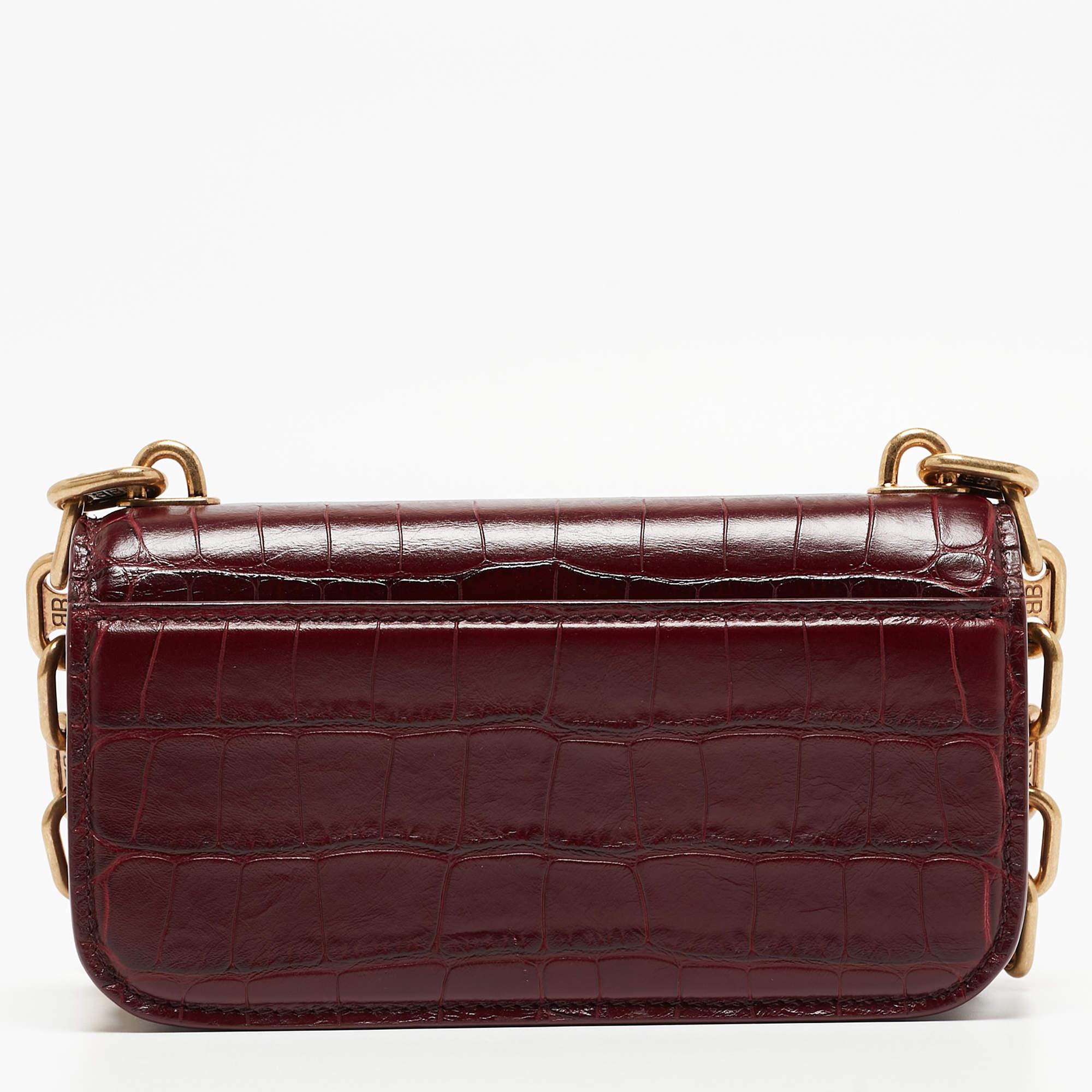 This Balenciaga burgundy bag for women is an example of the brand's fine designs that are skillfully crafted to project a classic charm. It is a functional creation with an elevating appeal.

Includes: Original Dustbag, Price Tag