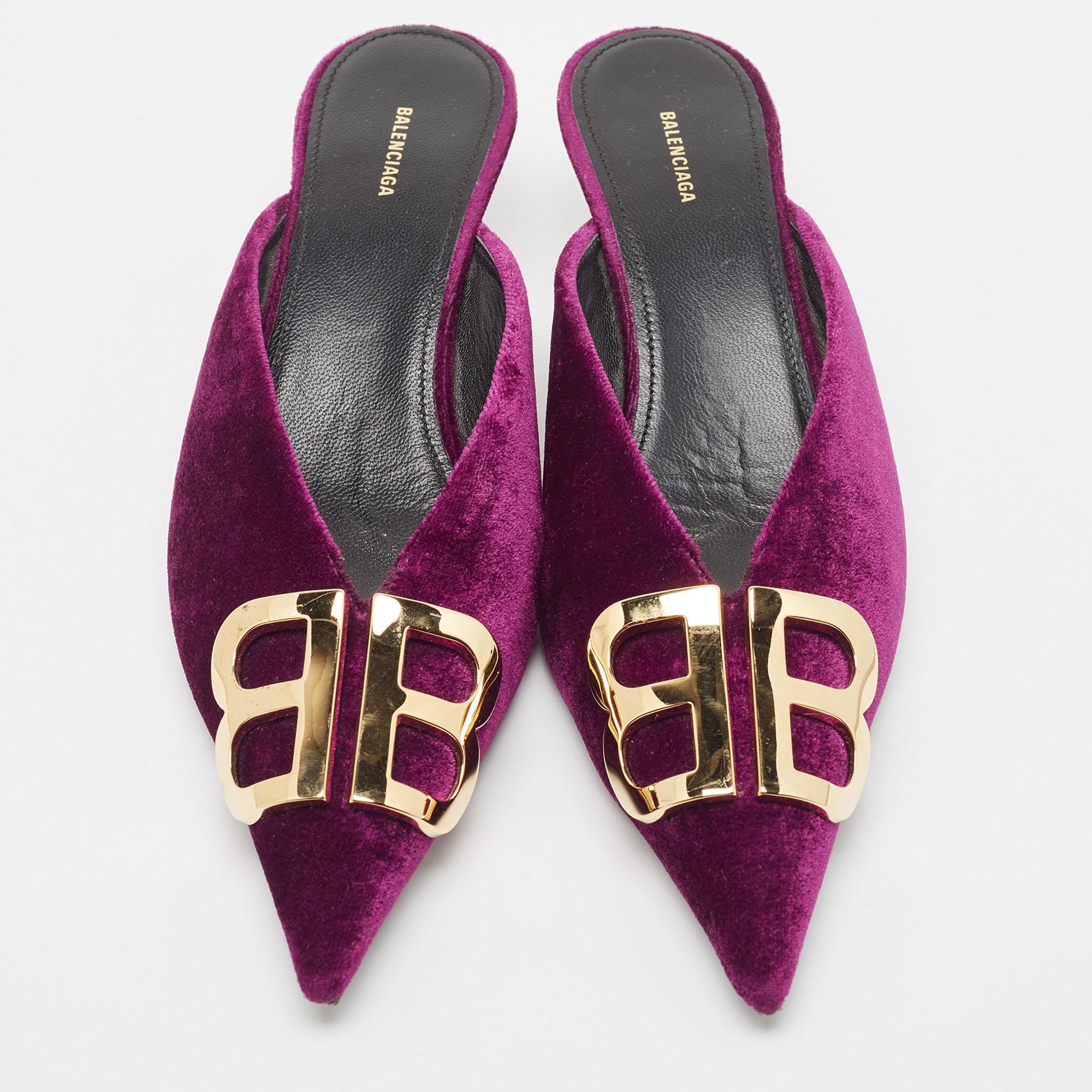 Sleek and sharp, these Balenciaga mules will perfectly complement any OOTD. They have elongated pointed toes and BB logo detailing on the uppers. The shoes are made using velvet and raised on kitten heels.

Includes: Original Dustbag, Extra Heel