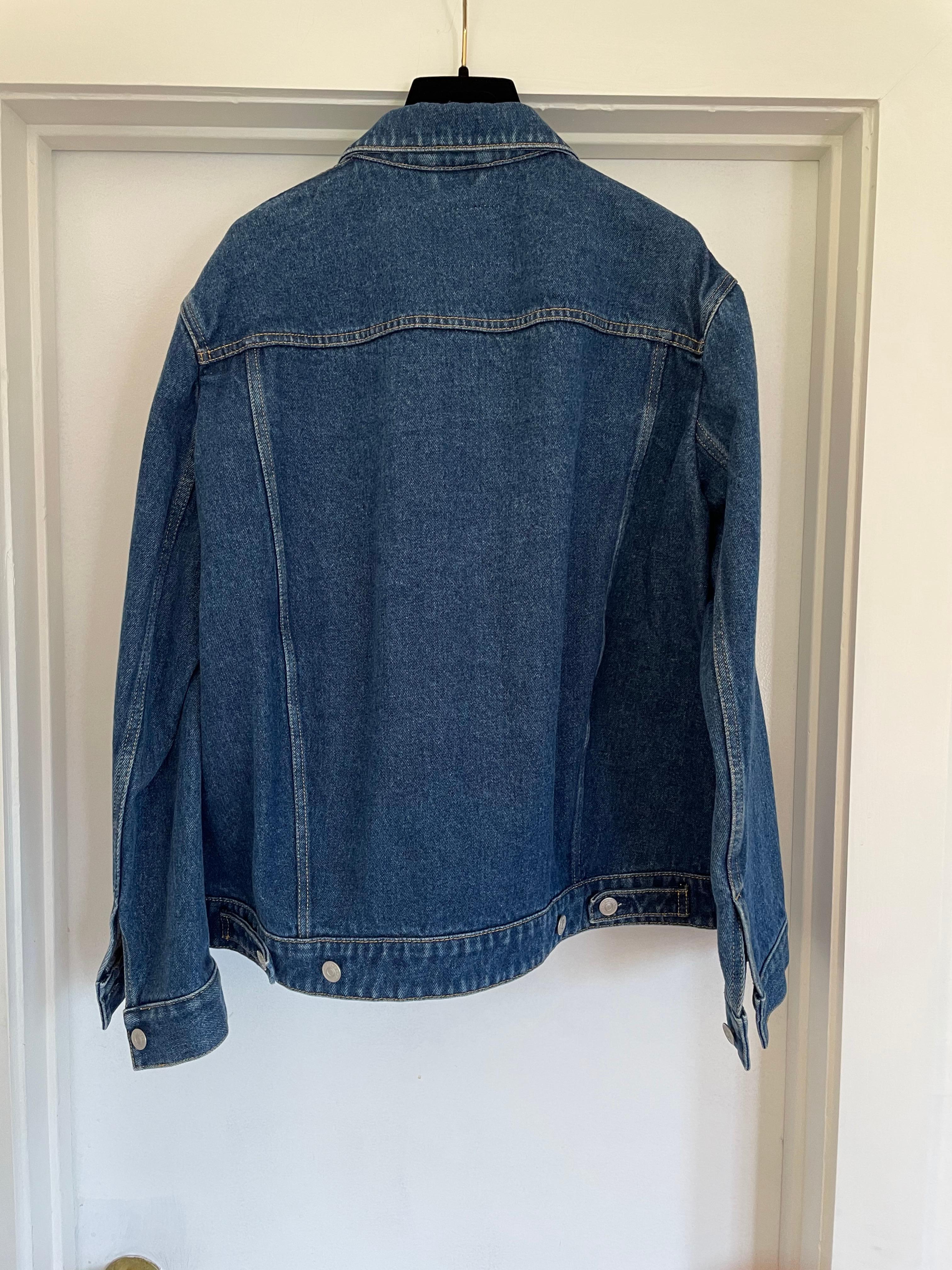 Dark blue denim jacket with unique shape designed by Demna Gvasalia for Balenciaga. French Size 38. Approximate measurements: shoulder 19' and arm length 24