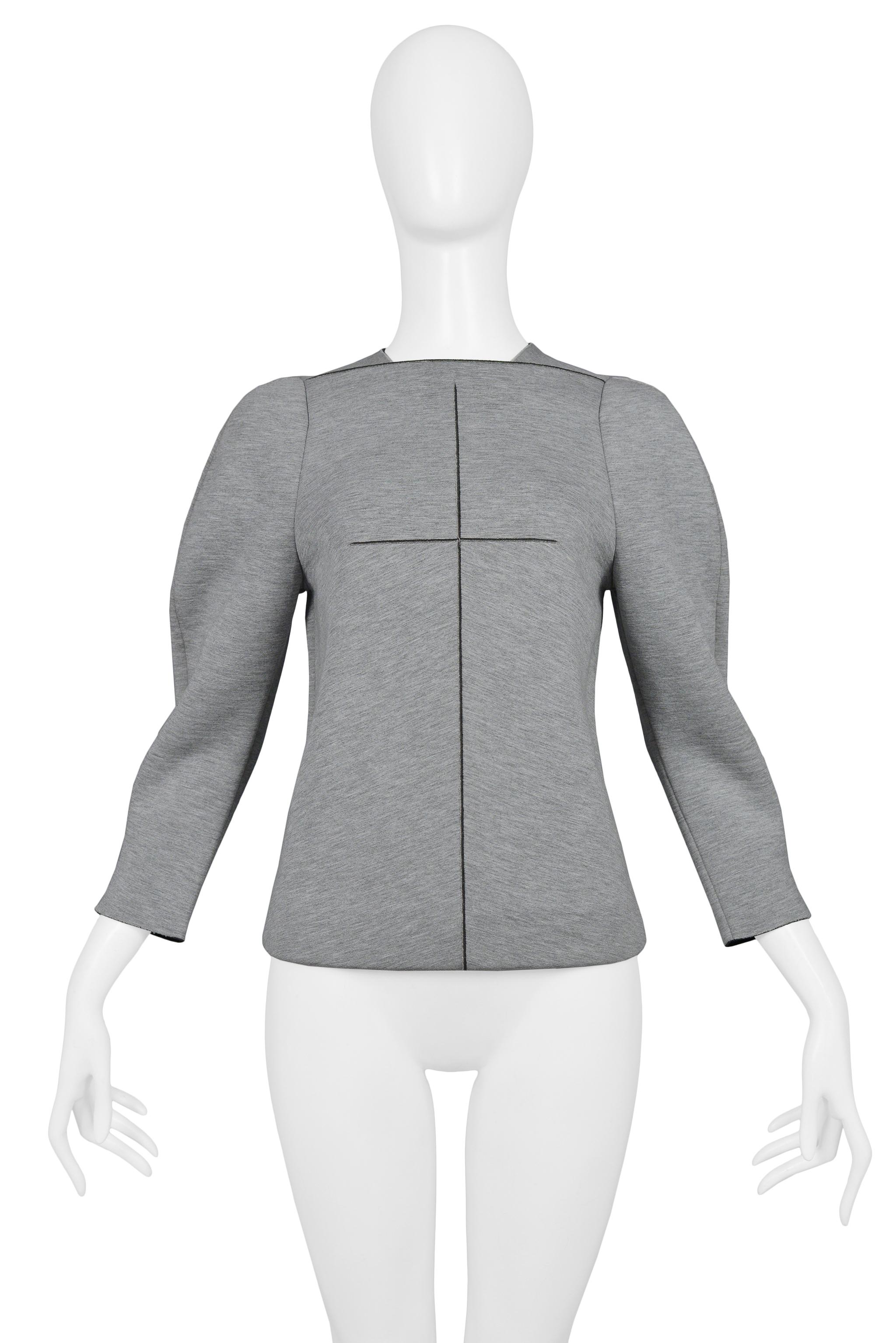 Resurrection Vintage is pleased to offer a vintage Balenciaga by Nicolas Ghesquiere grey neoprene top featuring 3/4 length sleeves, high neckline, cross seaming detail at the center front and back, and center back zipper. 

Balenciaga Paris
Designed