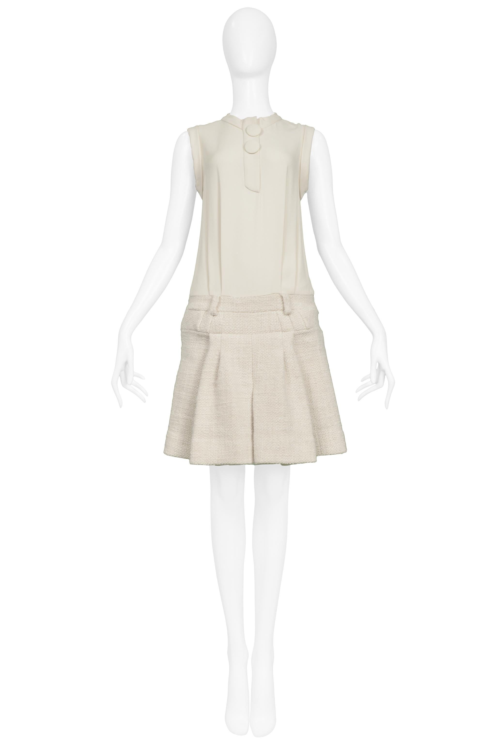 
Resurrection Vintage is excited to offer a vintage Nicolas Ghesquière for Balenciaga off-white silk and wool dress featuring a silk top, large buttons, box pleat skirt and above the knee length.

Balenciaga Paris
Designed by Nicolas Ghesquiere
Size