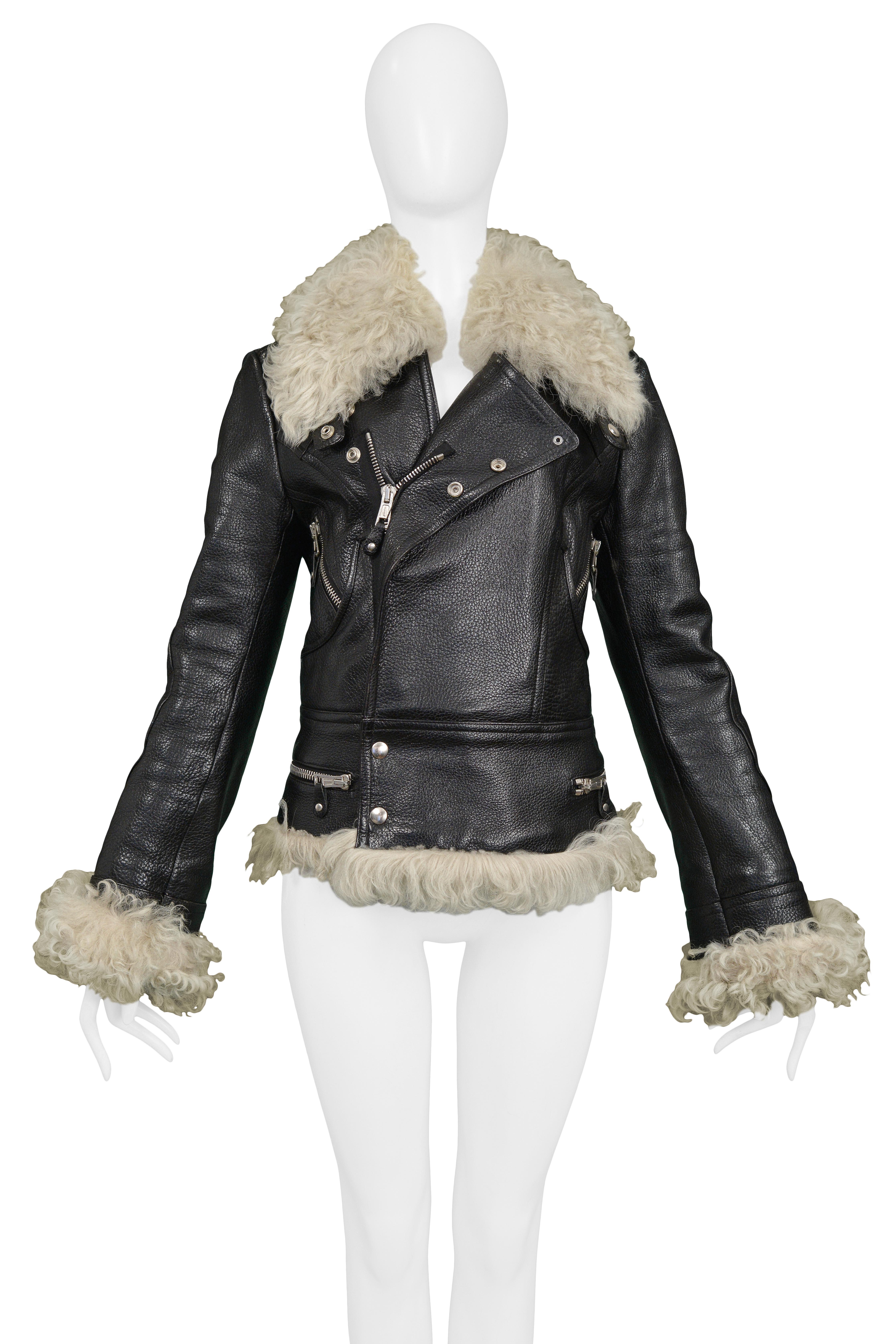 Resurrection Vintage is excited to offer an iconic vintage black leather Balenciaga by Nicolas Ghesquiere motorcycle jacket featuring a curly fur trim collar, cuffs, and hem, silver zippers and snaps, and fully lined.  

Balenciaga Paris
Designed by