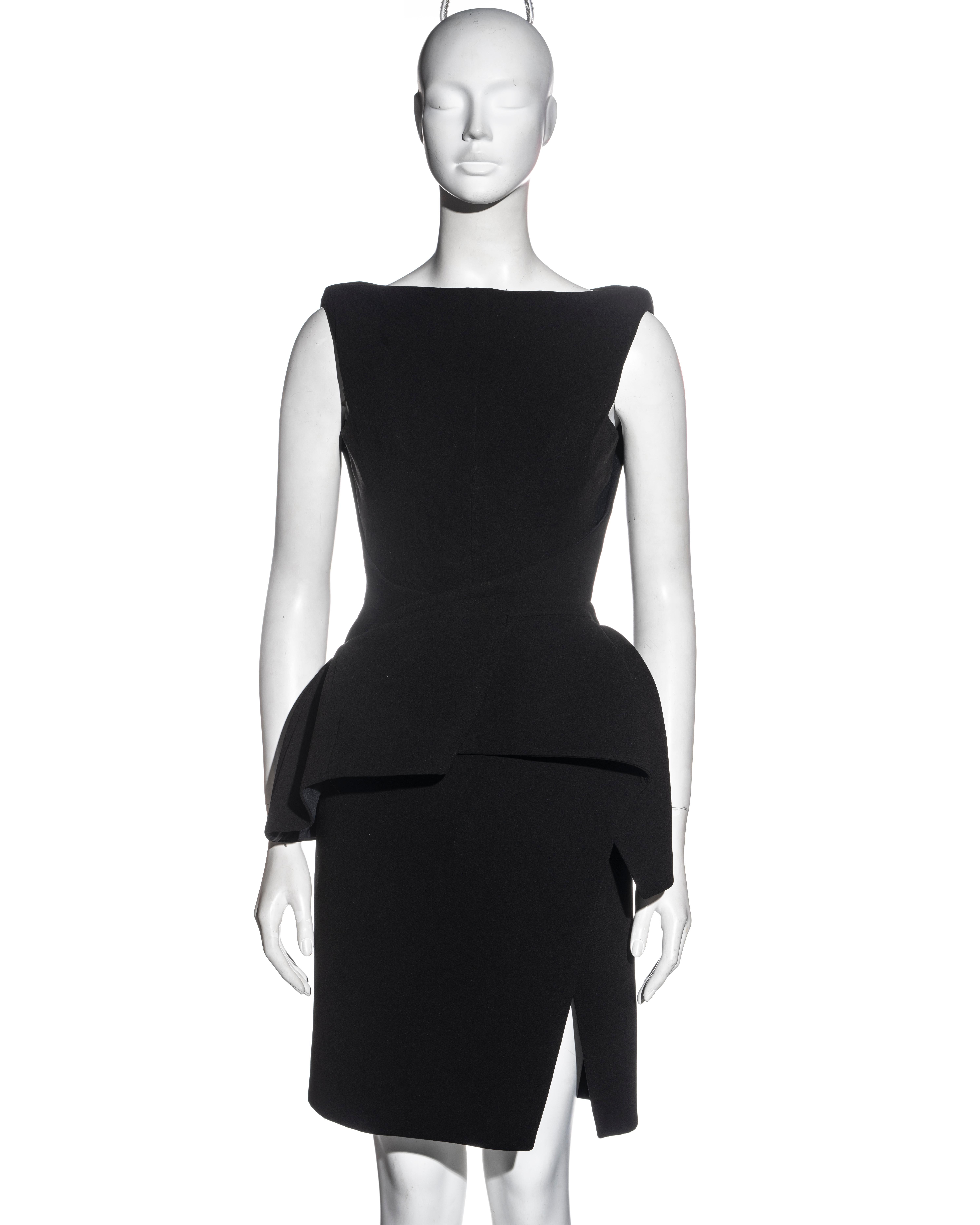 ▪ Balenciaga black structured cocktail dress
▪ Designed by Nicolas Ghesquière
▪ Asymmetric draped peplum
▪ Slit skirt 
▪ Corseted bodice
▪ Padded shoulders 
▪ FR 38 - UK 10 - US 6
▪ Fall-Winter 2008
▪ Fabric 1: 71% Acetate, 29% Polyester
▪ Fabric 2:
