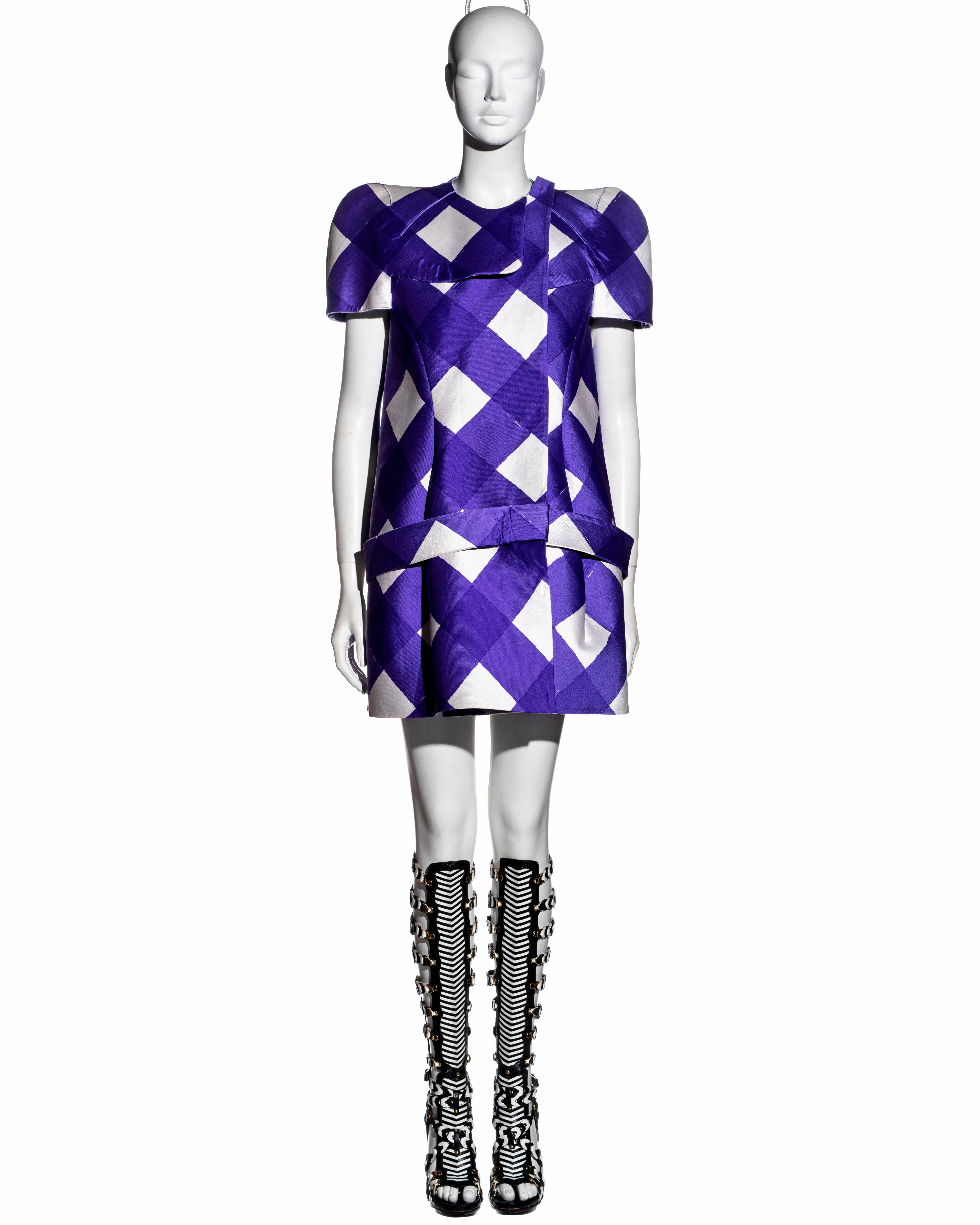 ▪ Important Balenciaga purple and white checked silk mini dress
▪ Designed by Nicolas Ghesquière 
▪ Structured form made out of silk backed with foam
▪ Edges expose the layers of fabric sliced using a high-tech ultrasound machine
▪ Attached belt at