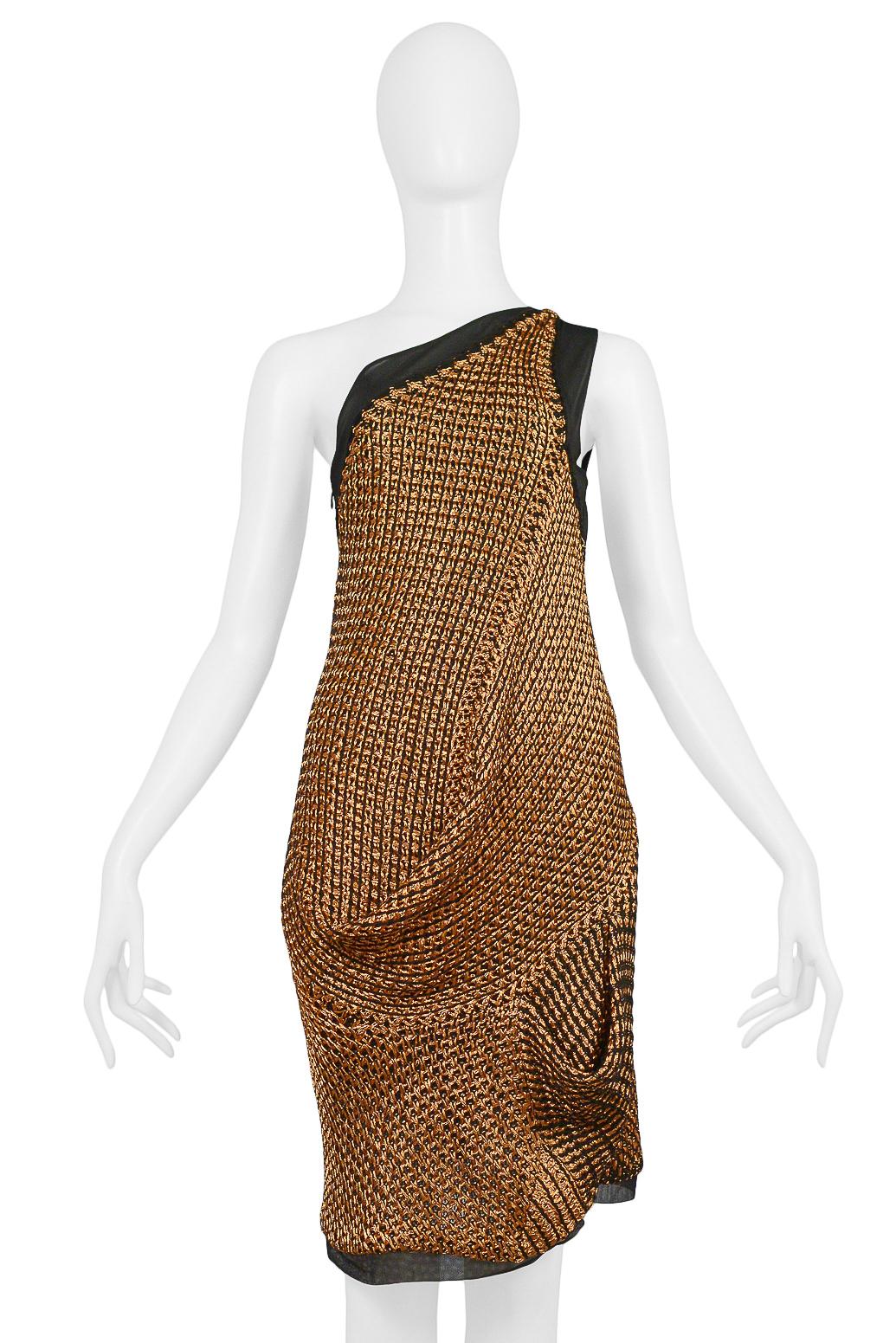 Resurrection Vintage is excited to offer a vintage Balenciaga by Nicolas Ghesquiere copper knit cocktail dress featuring an asymmetrical bodice, drape skirt, black mesh trim, and side zipper.
Balenciaga Paris
Designed by Nicolas Ghesquiere
Size