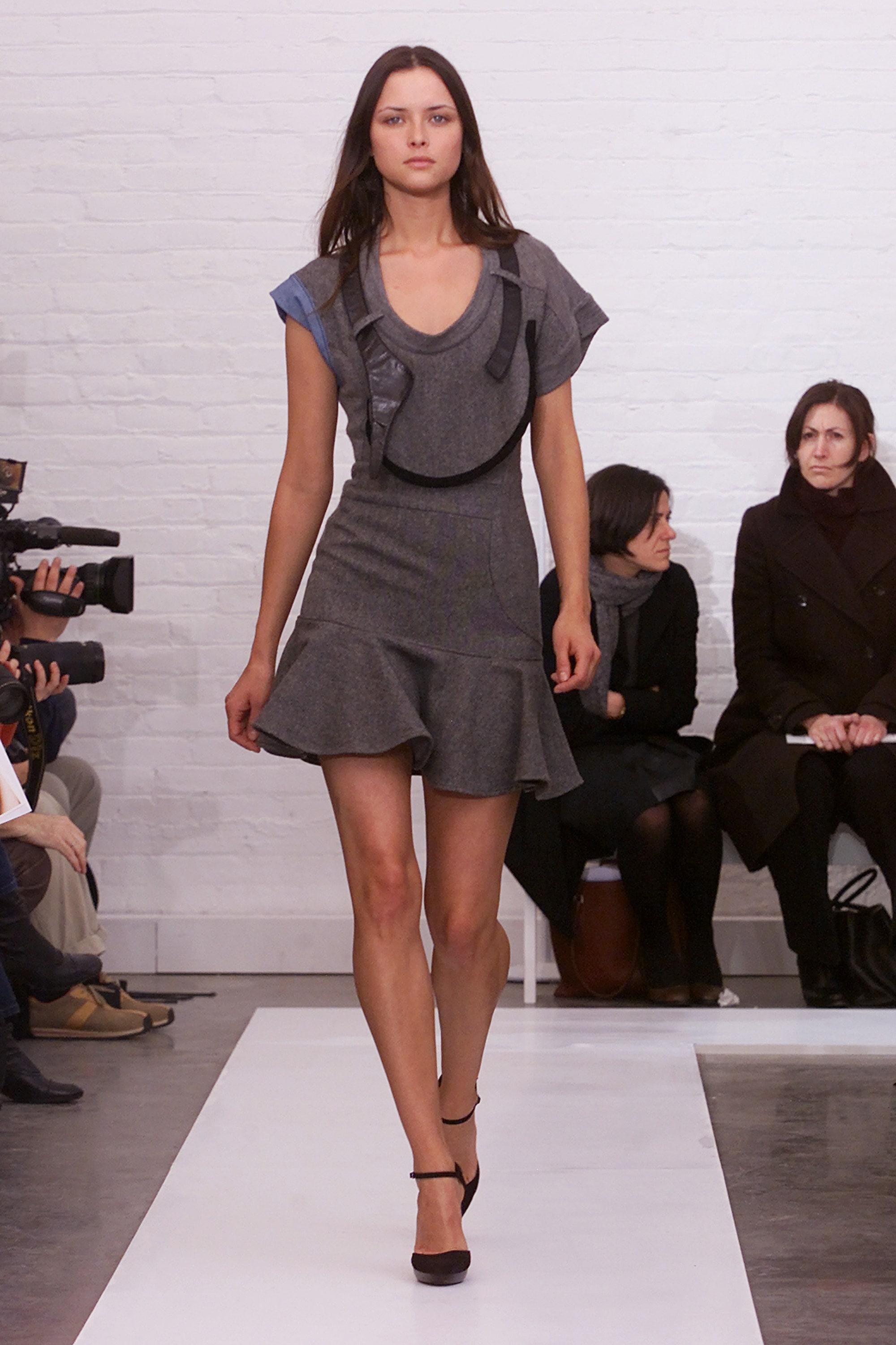 Balenciaga by Nicolas Ghesquière Cubist Flounce Hem Dress
Fall 2002 Runway Collection
A striking and collectible piece from Nicolas Ghesquière’s early tenure at Balenciaga, this dress epitomizes his architectural, avant-garde vision.
Grey wool knit