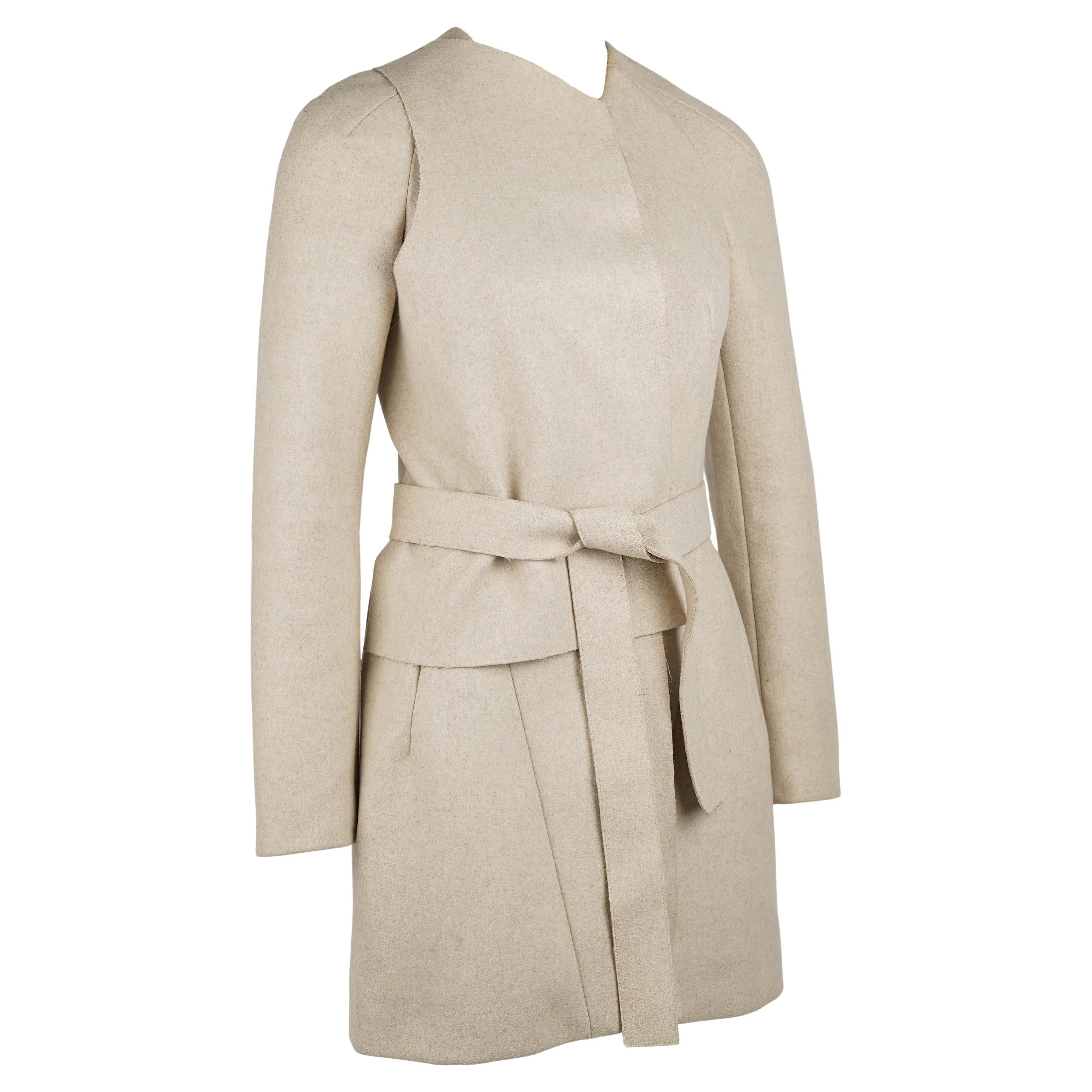 An exceptional and collectible runway piece from Balenciaga’s Fall/Winter 2010 collection, designed by Nicolas Ghesquière during his most celebrated creative era. This sculptural wool-blend coat perfectly captures Ghesquière’s mastery of
