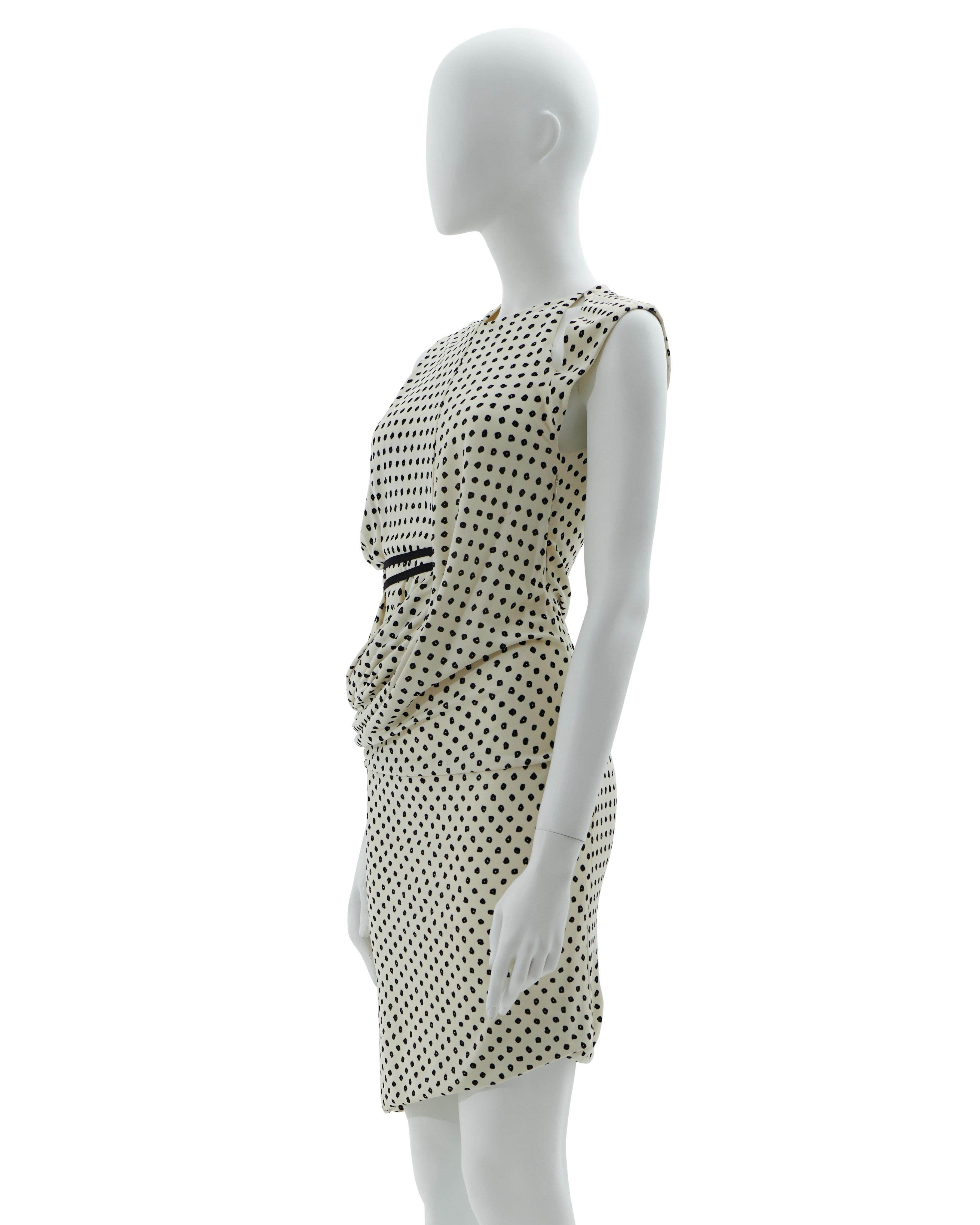 - Resort 2009 
- Sold by Skof.Archive 
- Designed by Ghesquière 
- Black and white all over printed asymmetric cocktail dress
- Sleveless
- Hidden side zipper closure 
- Draped asymmetric detail 
- Made in France 

Conditions: Good 

Composition: