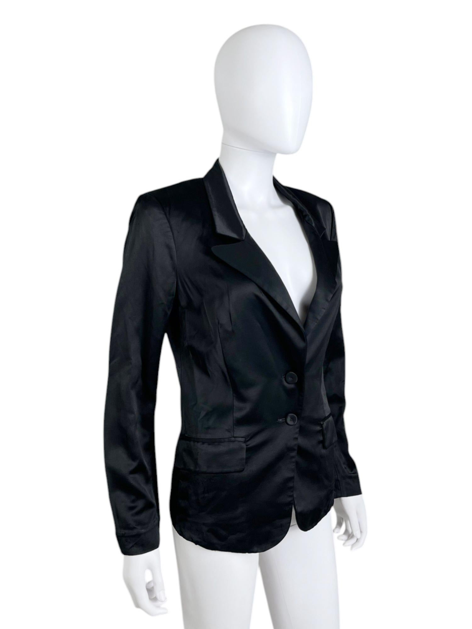 - Designed by Nicolas Ghesquière
- Spring Summer 2006
- Black Blazer
- Satin effect
- Double frontal pockets
- Button up closure
- Good condition: some little holes on the back but not very visible
- Made in Italy
- Materials: Viscose and wool
-