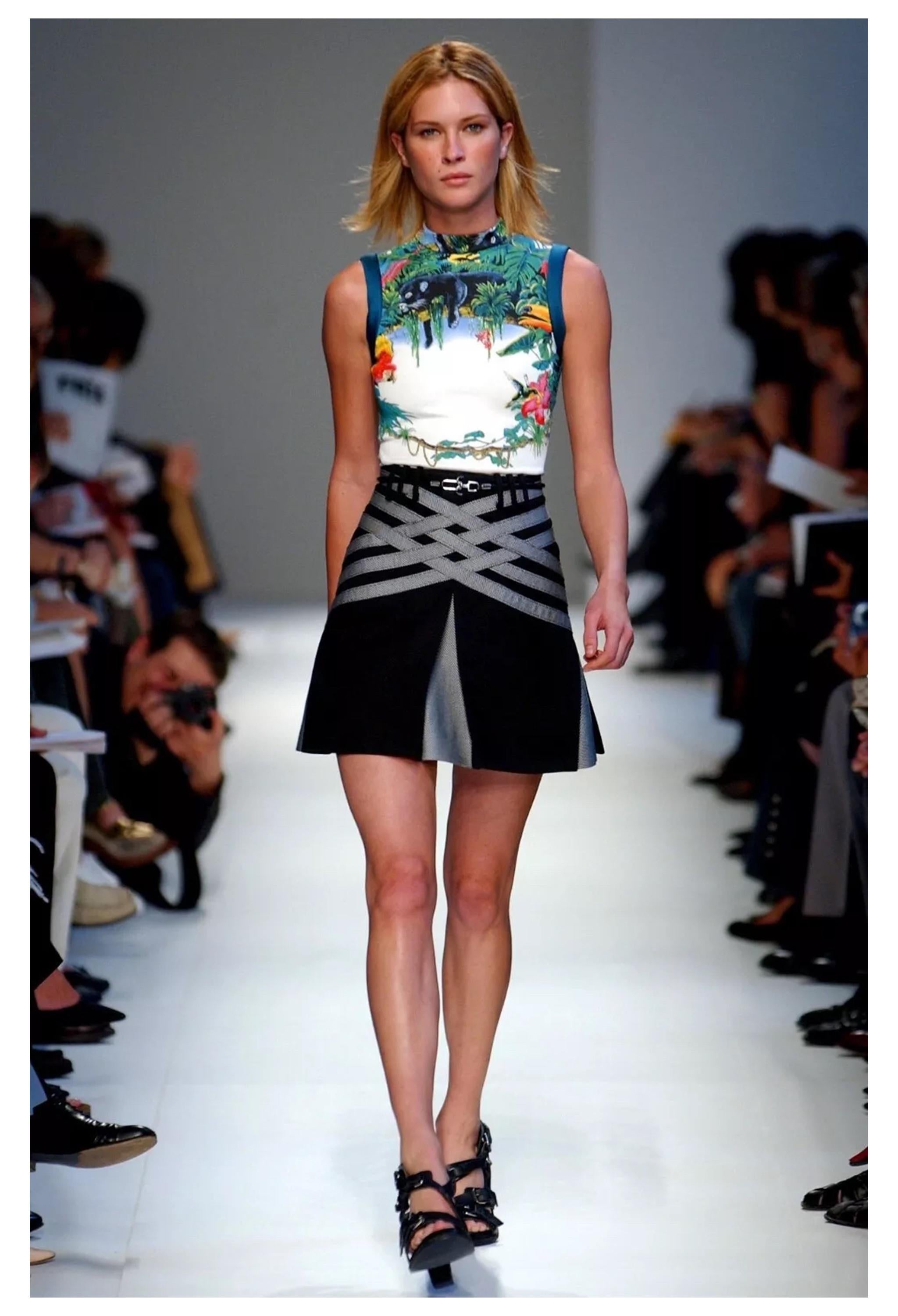 Resurrection Vintage is excited to offer a vintage Balenciaga by Nicolas Ghesquiere scuba collection ensemble featuring a tropical printed top with padded sleeves and a high-waisted pleated skirt with lattice design and belt loops. 
Balenciaga