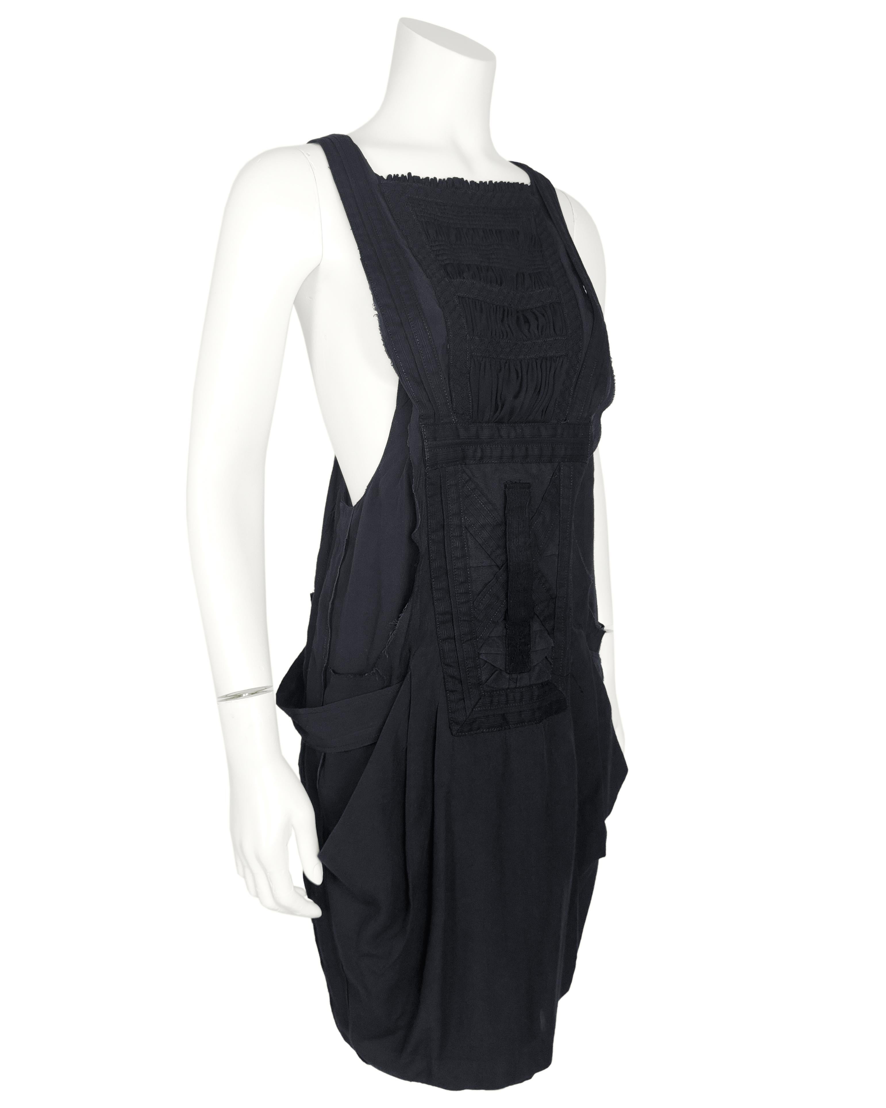 An avant-garde essential from Ghesquière's iconic early 2000s era at Balenciaga, this dress embodies the utilitarian romance of the Le Dix years. Constructed in a fluid viscose blend, the dress features a raised squared neckline, with a tiered