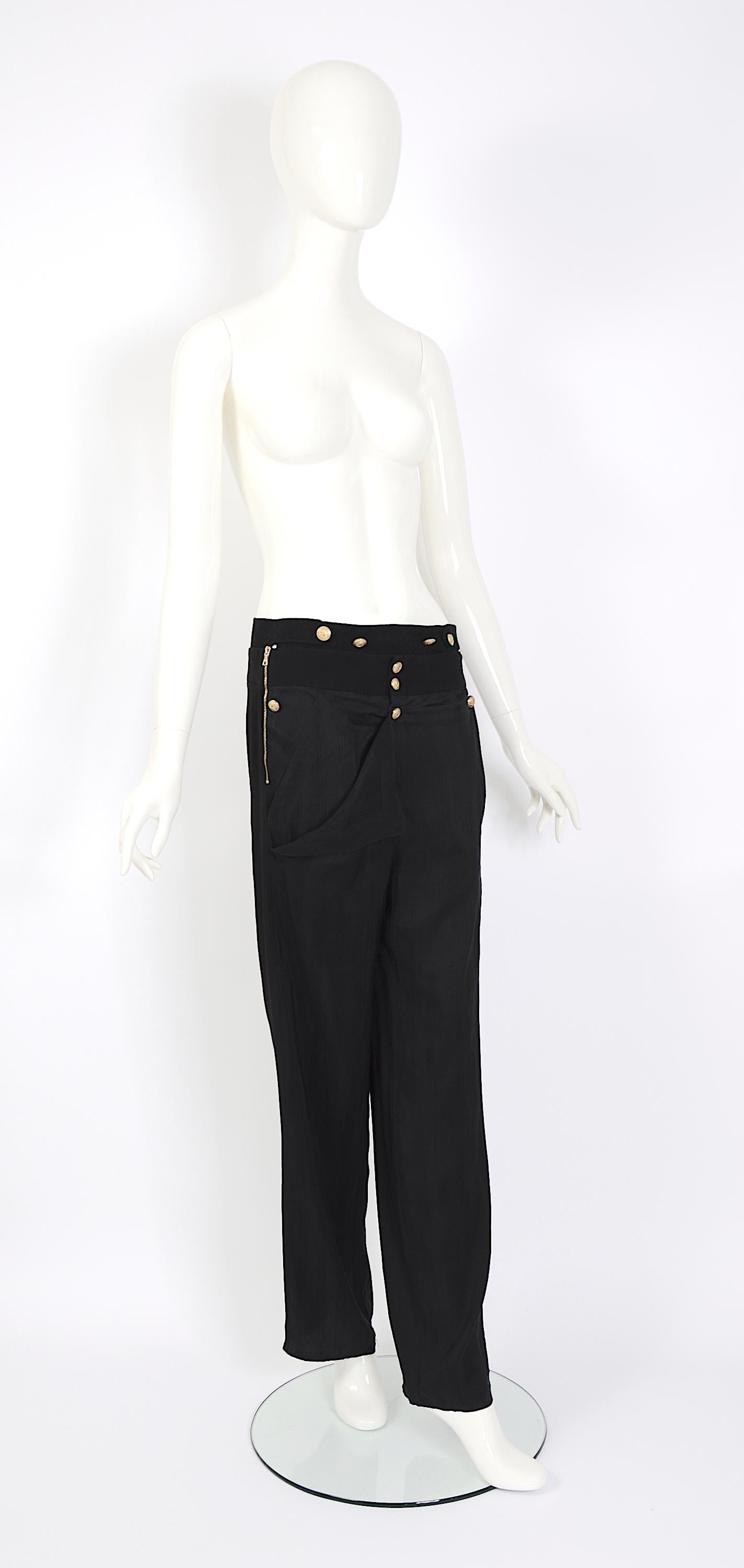 Iconique and very collectible Balenciaga by Nicolas Ghesquière SS 2005 runway black silk military brass buttons pants.
French size 38
Styled to perfection, these trousers exude an effortless allure. They were designed to be worn with a slight