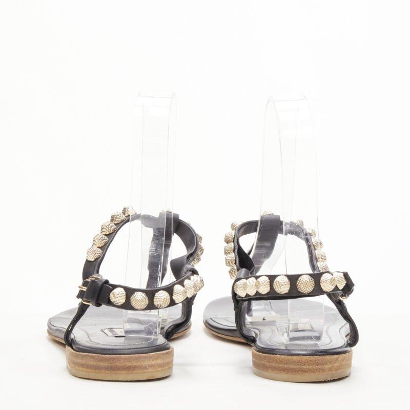 Women's BALENCIAGA Cagole black leather gold textured  stud T-strap flat sandals EU38 For Sale