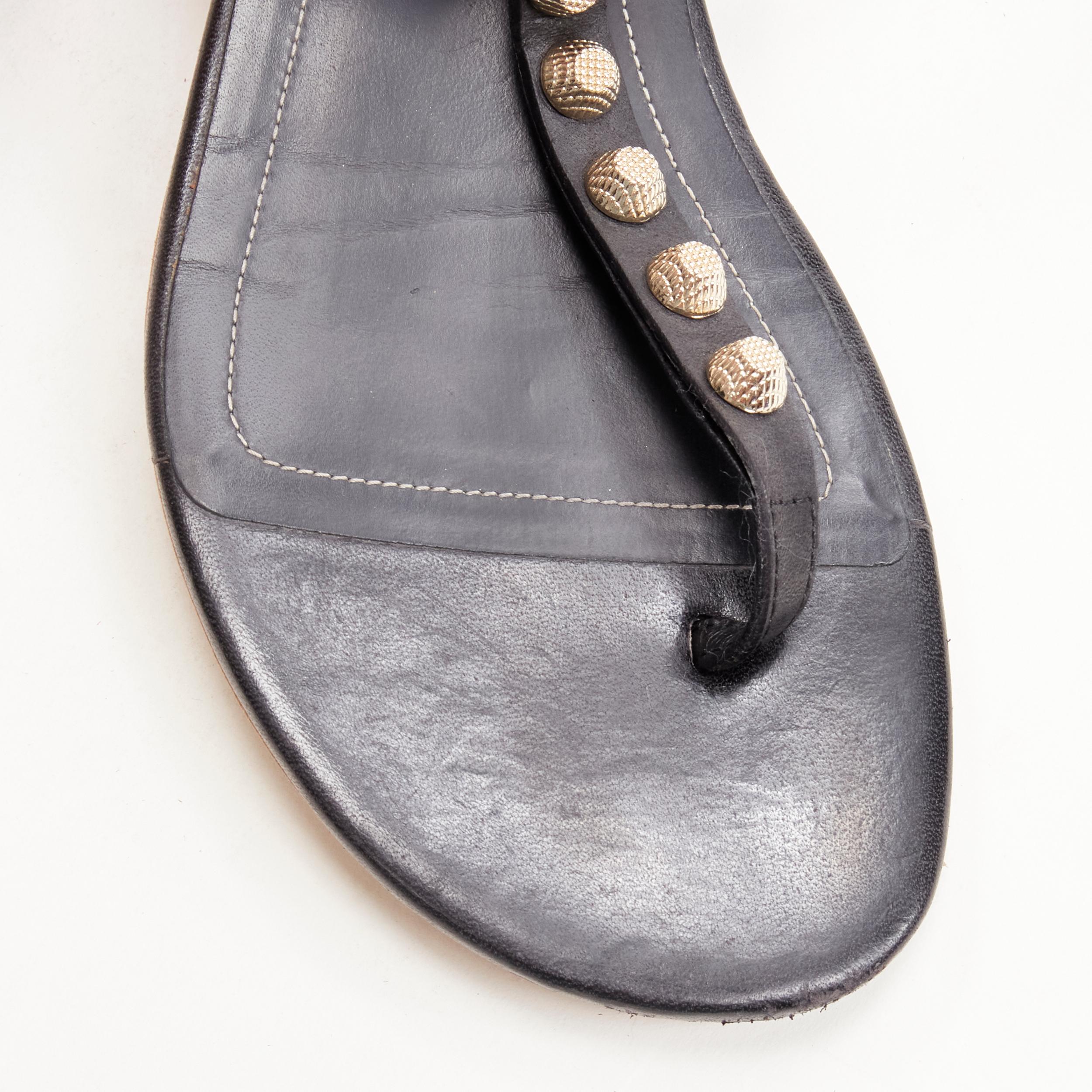 Women's BALENCIAGA Cagole black leather gold textured  stud T-strap flat sandals EU38 For Sale